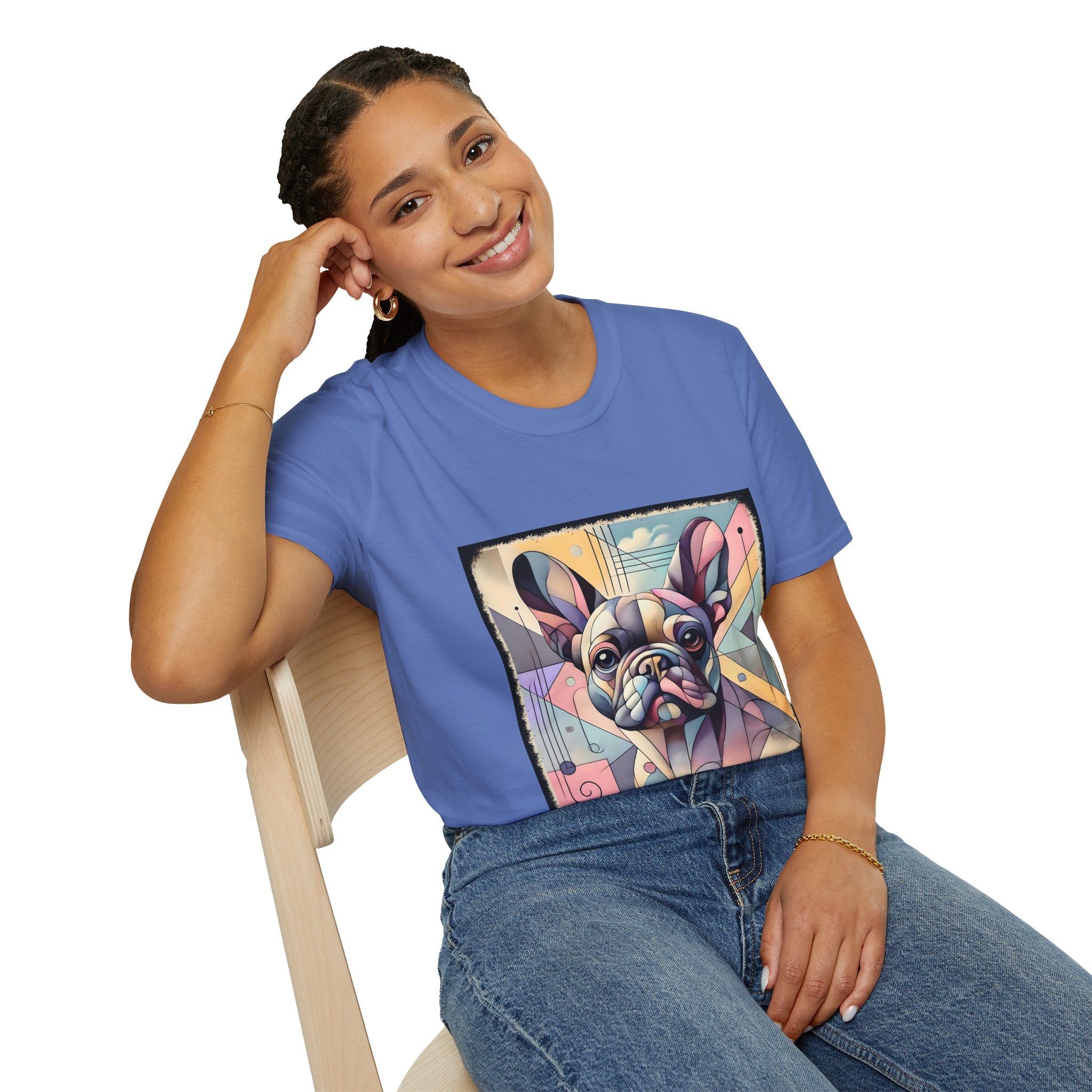 Woman sitting in cornflower blue shirt with Cubism-style French Bulldog design in soft pastel colors and abstract shapes.