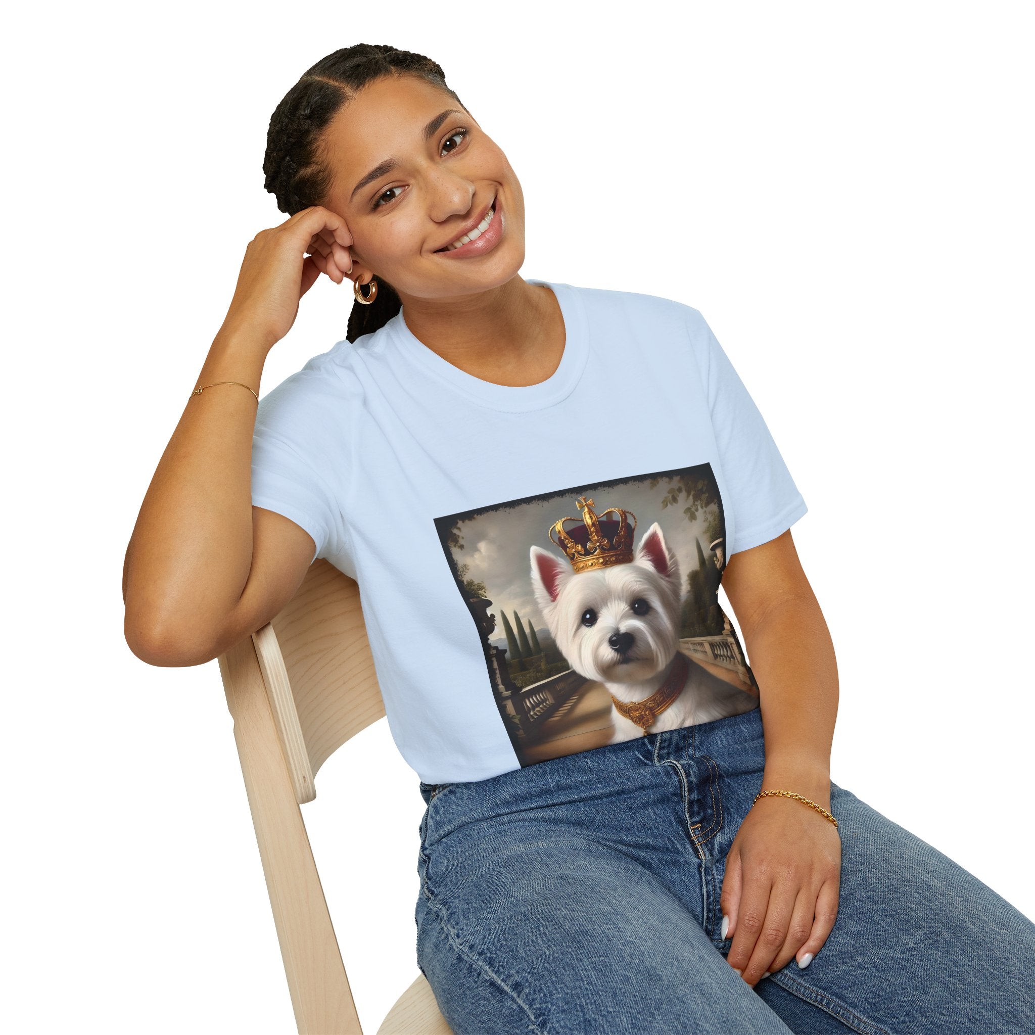 Female model in light blue dog t-shirt featuring regal Westie in gold crown and collar on palace terrace background.