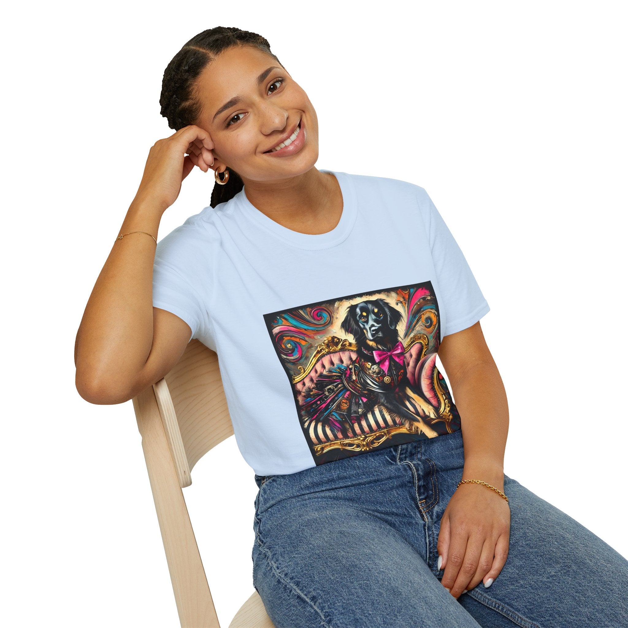 Female model in light blue dog t-shirt with black retriever in edgy outfit and pink bow on striped settee, swirl backdrop.