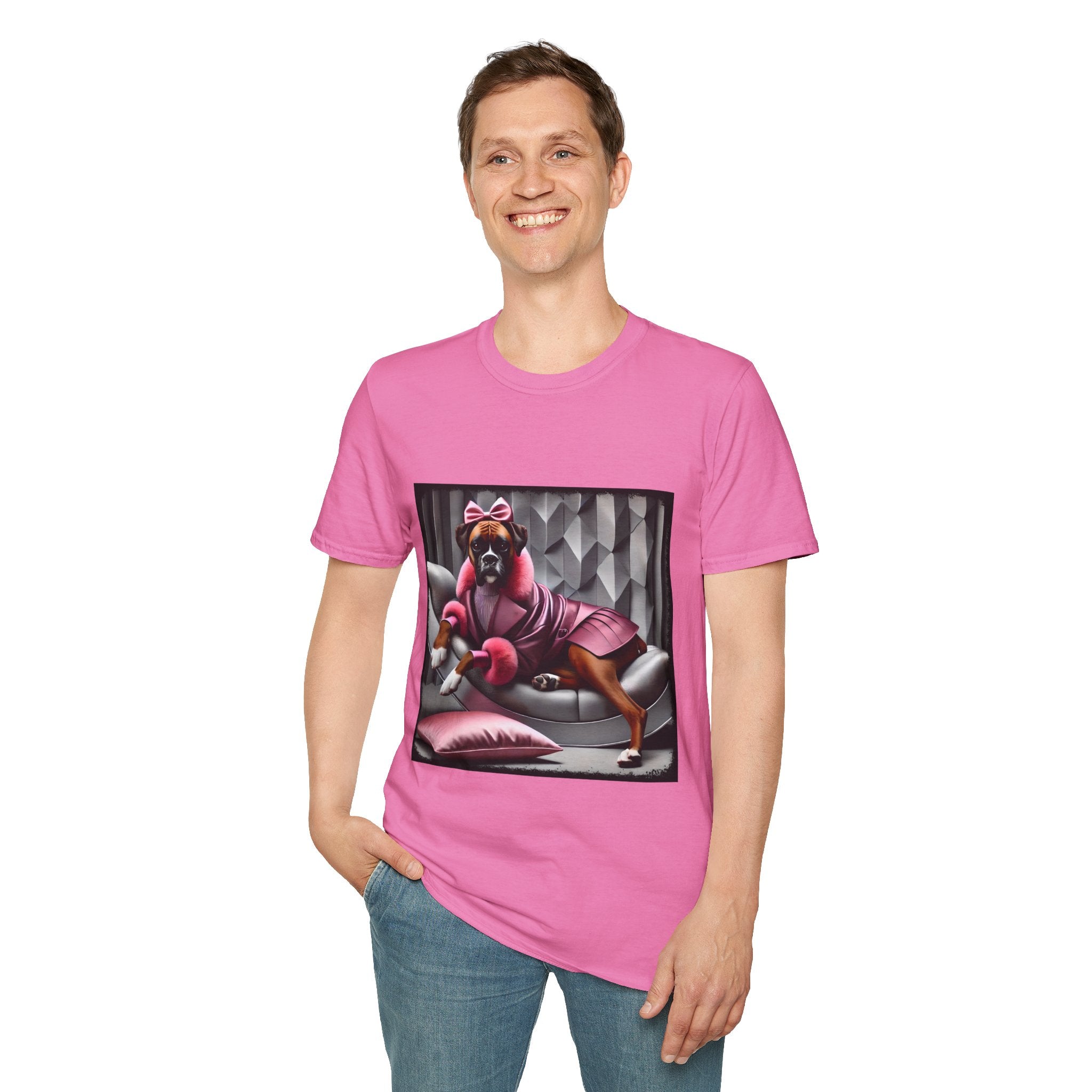 Male model in pink dog t-shirt featuring boxer in pink bow and pleated pink coat lounging on silver settee.