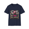 Navy dog t-shirt featuring golden retriever with pink bow and fur outfit on black settee in edgy backdrop.