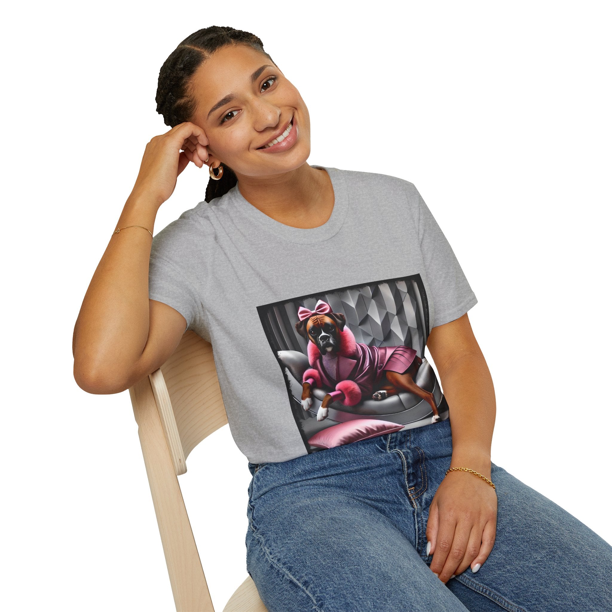 Female model in sport gray dog t-shirt featuring boxer in pink bow and pleated pink coat lounging on silver settee.