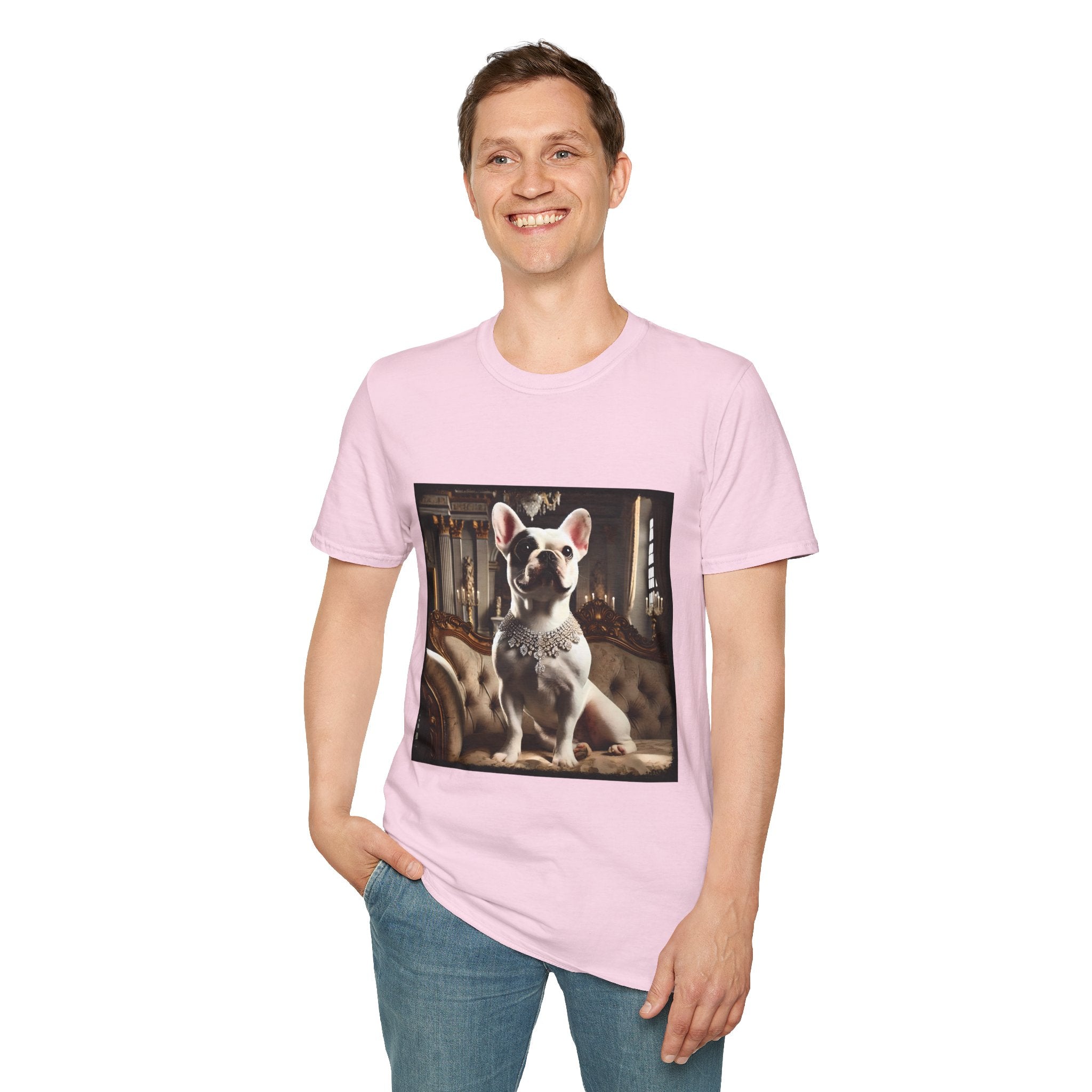 Man smiling in light pink dog t-shirt featuring white French Bulldog in jeweled necklace on tufted settee in elegant palace setting.