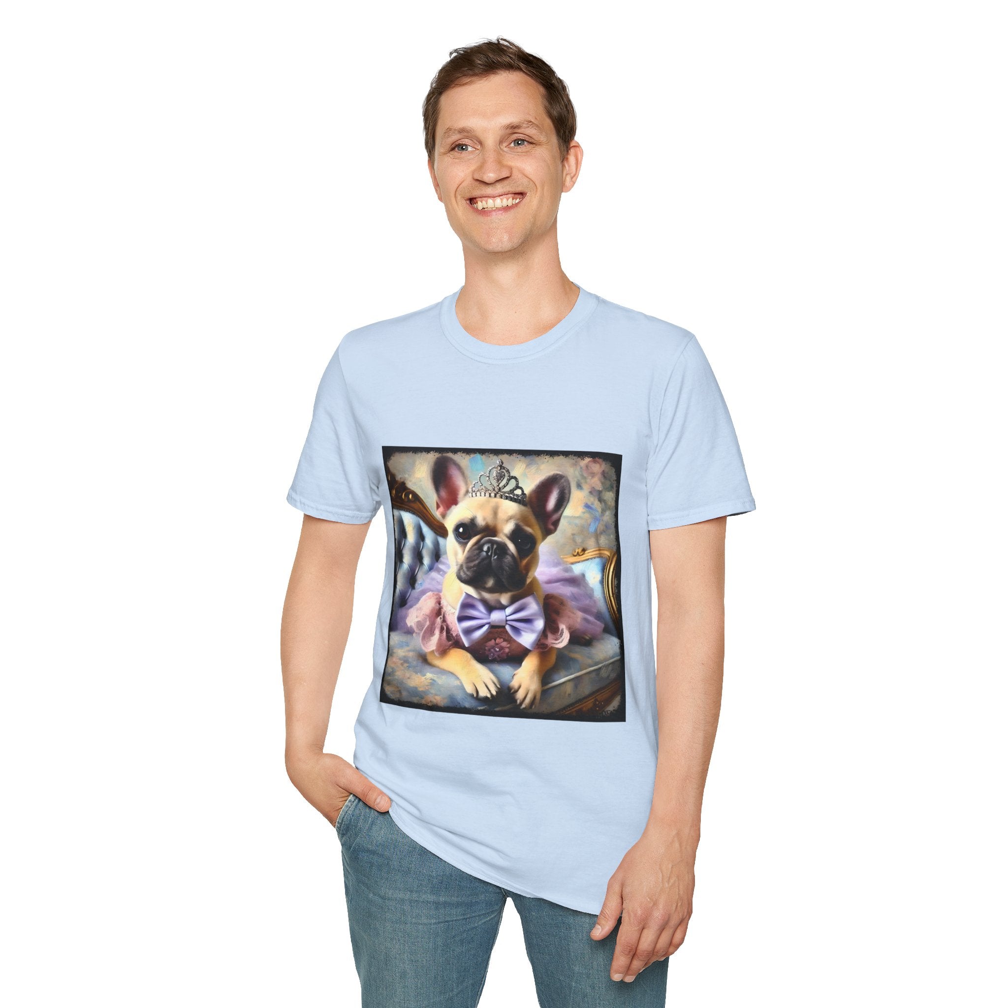 Man smiling in light blue dog t-shirt featuring French Bulldog in tiara and tutu on royal chair with dreamy pastel background.