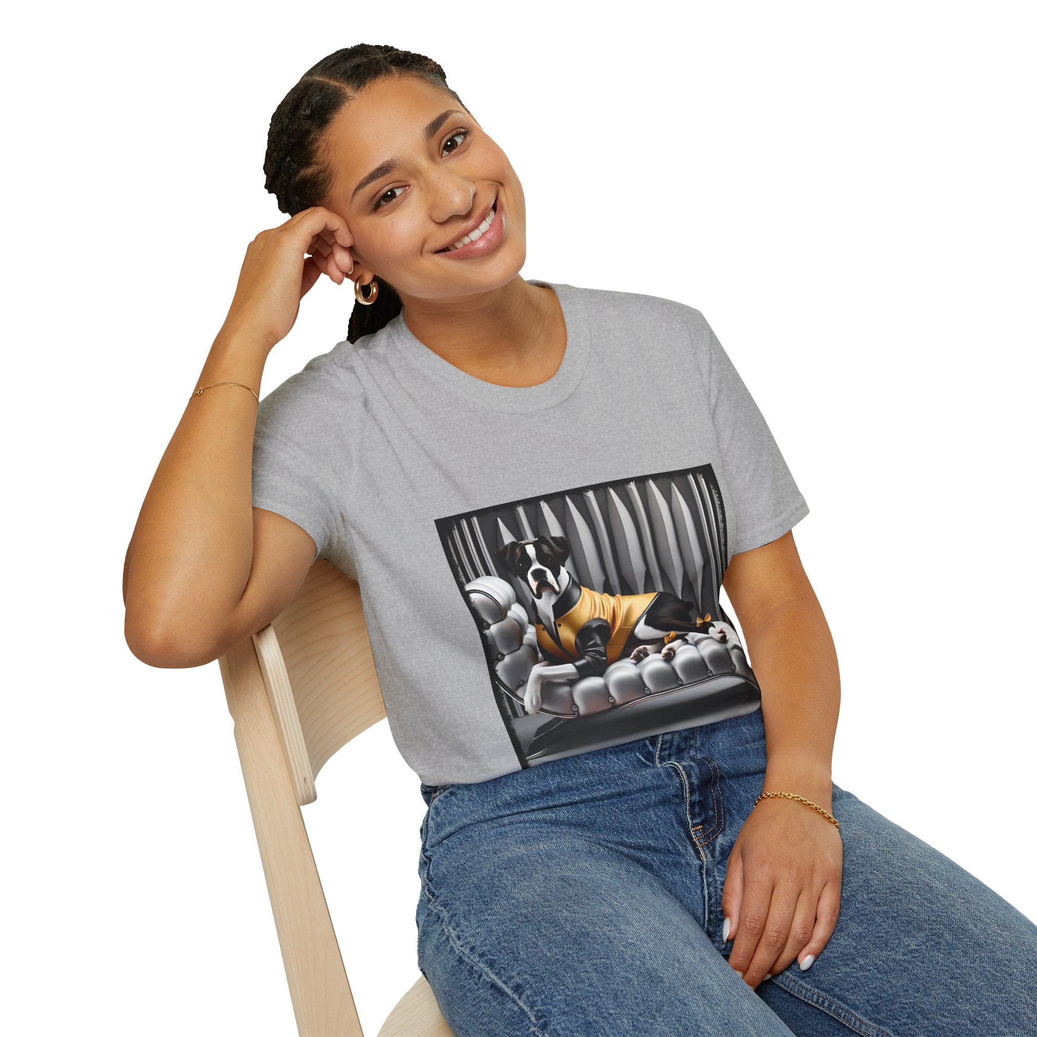 Female model in sport gray dog t-shirt featuring a black and white boxer lounging on silver tufted couch in yellow jacket with striped wall.