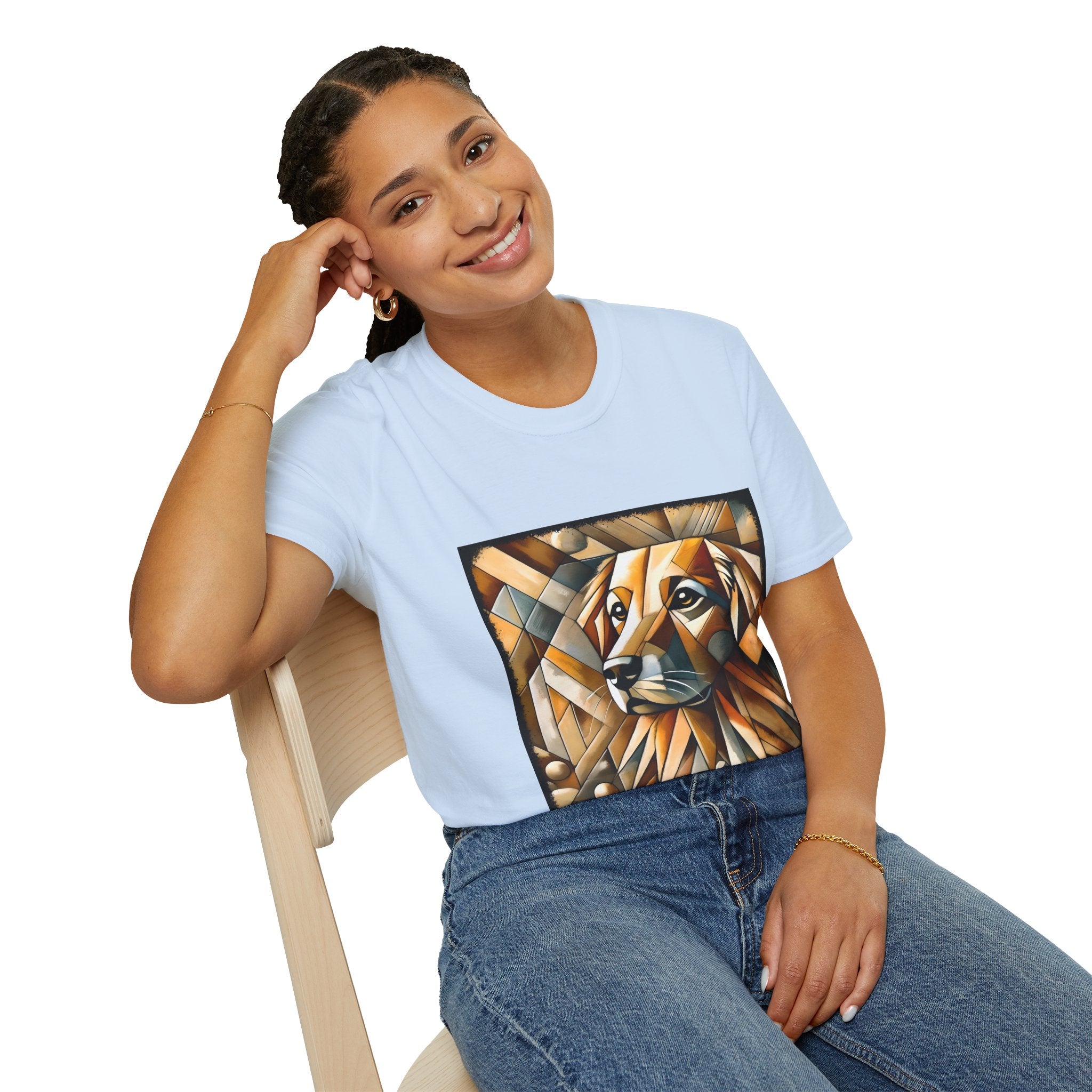 Female sitting in light blue dog t-shirt featuring golden retriever in geometric cubist style with warm amber and tan tones.