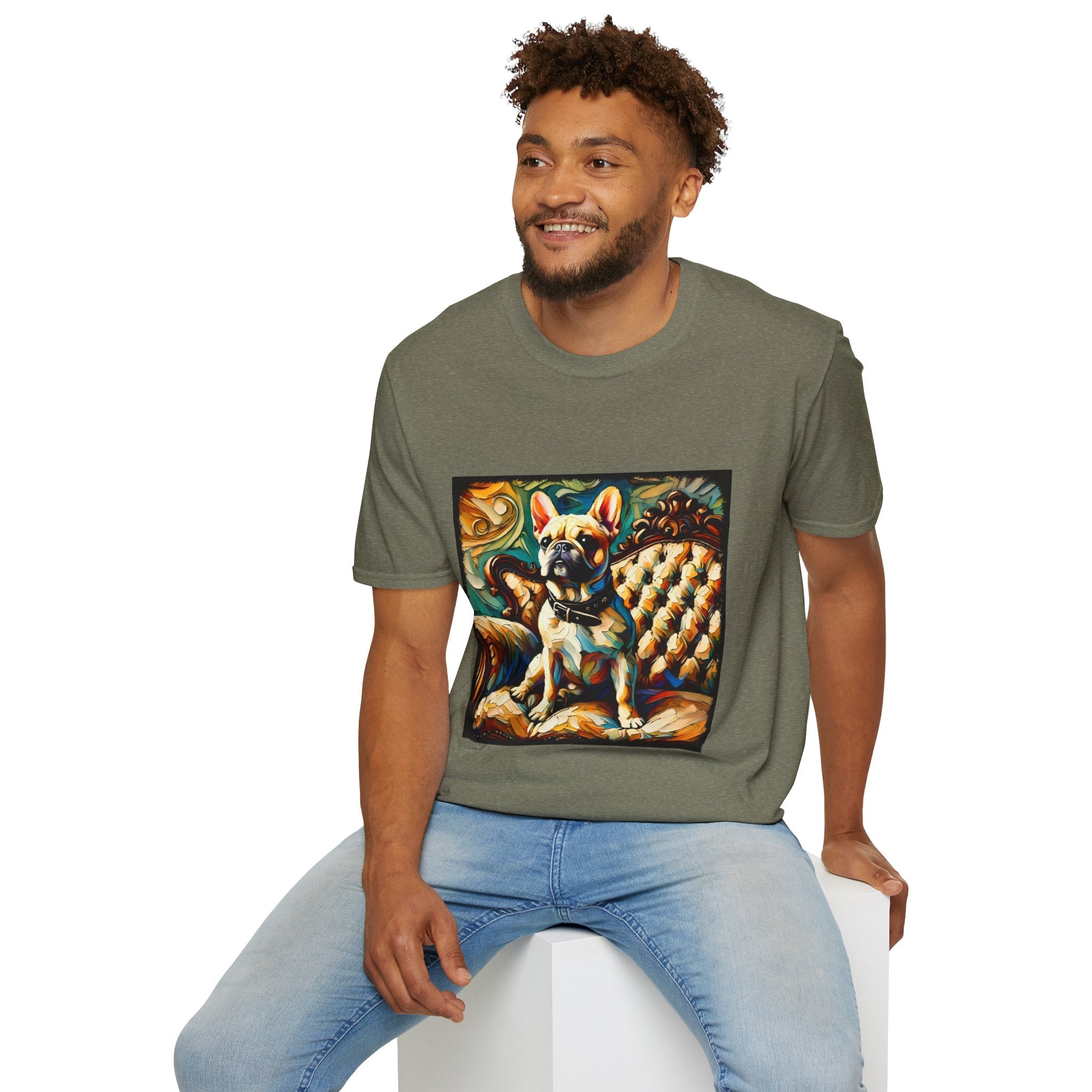 Male model in heather military green dog t-shirt featuring fawn French Bulldog with collar on golden tufted settee and bold swirl backdrop.