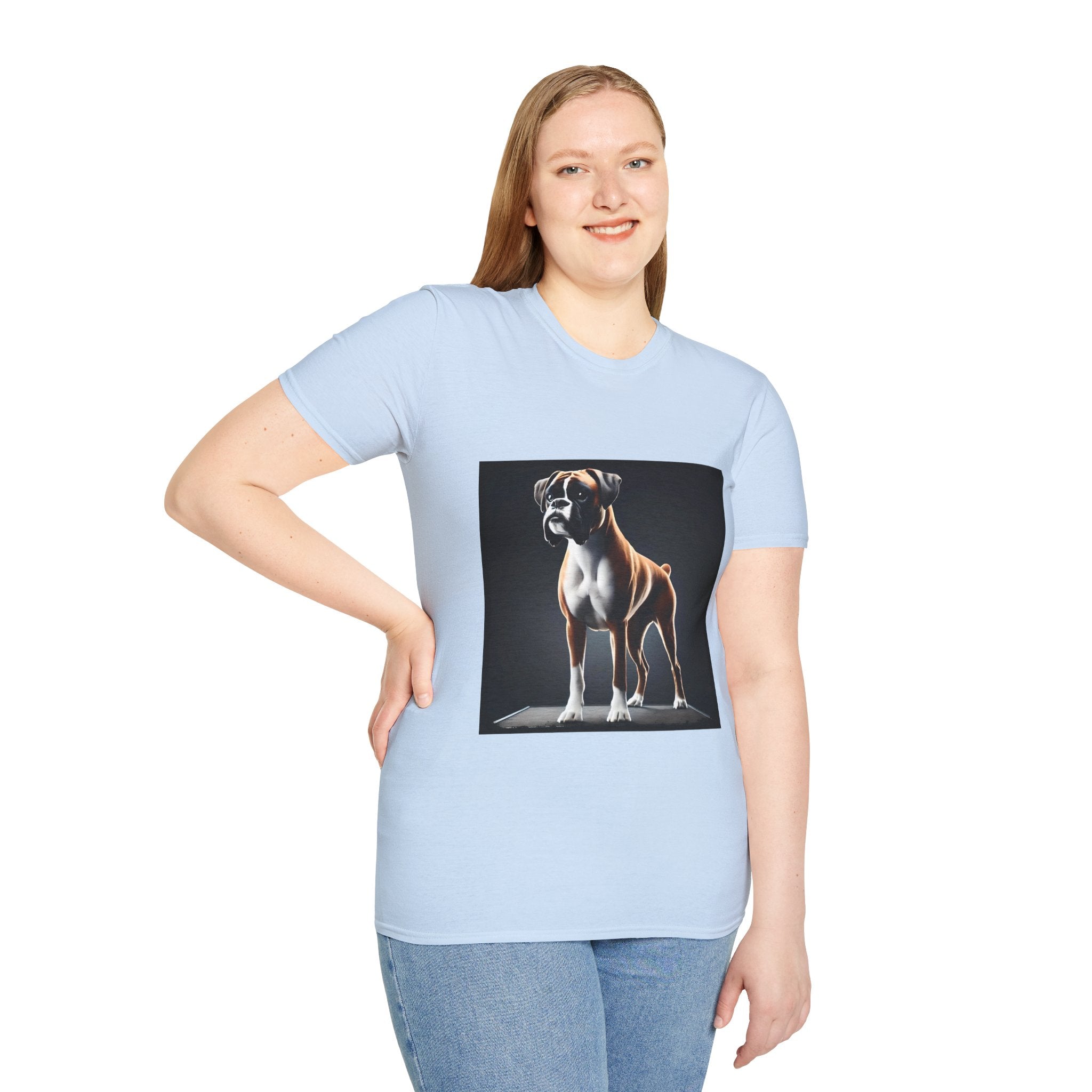 Female model in light blue dog t-shirt featuring standing boxer on platform with black background and dramatic lighting.