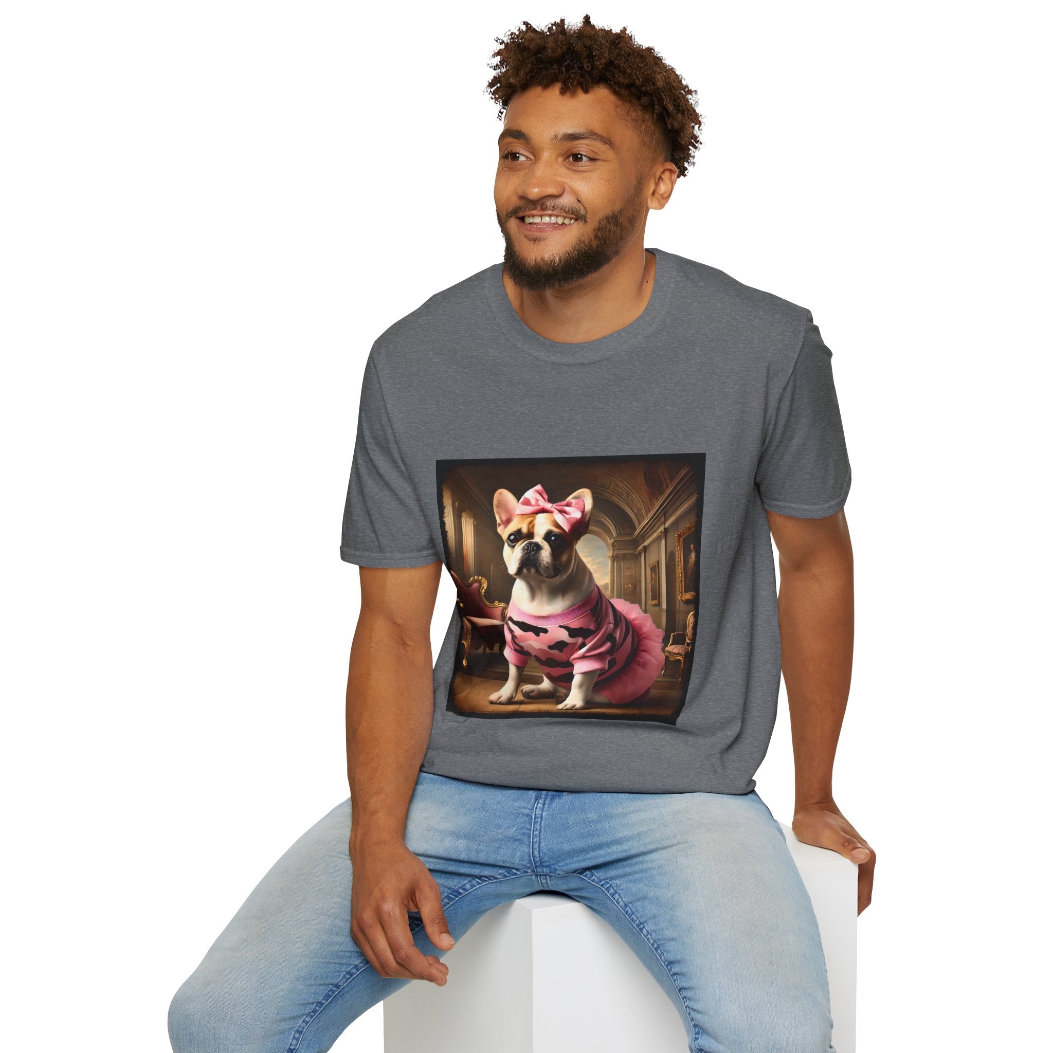 Male model in graphite heather dog t-shirt featuring fawn and white French Bulldog in pink camouflage dress and bow in ornate hallway scene.