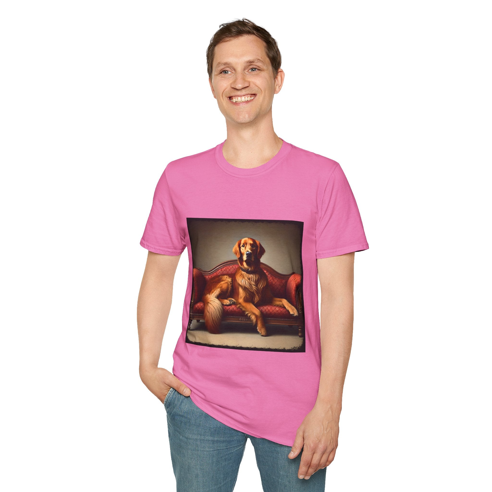 Male model in pink dog t-shirt with golden retriever lounging on vintage red settee with regal posture.