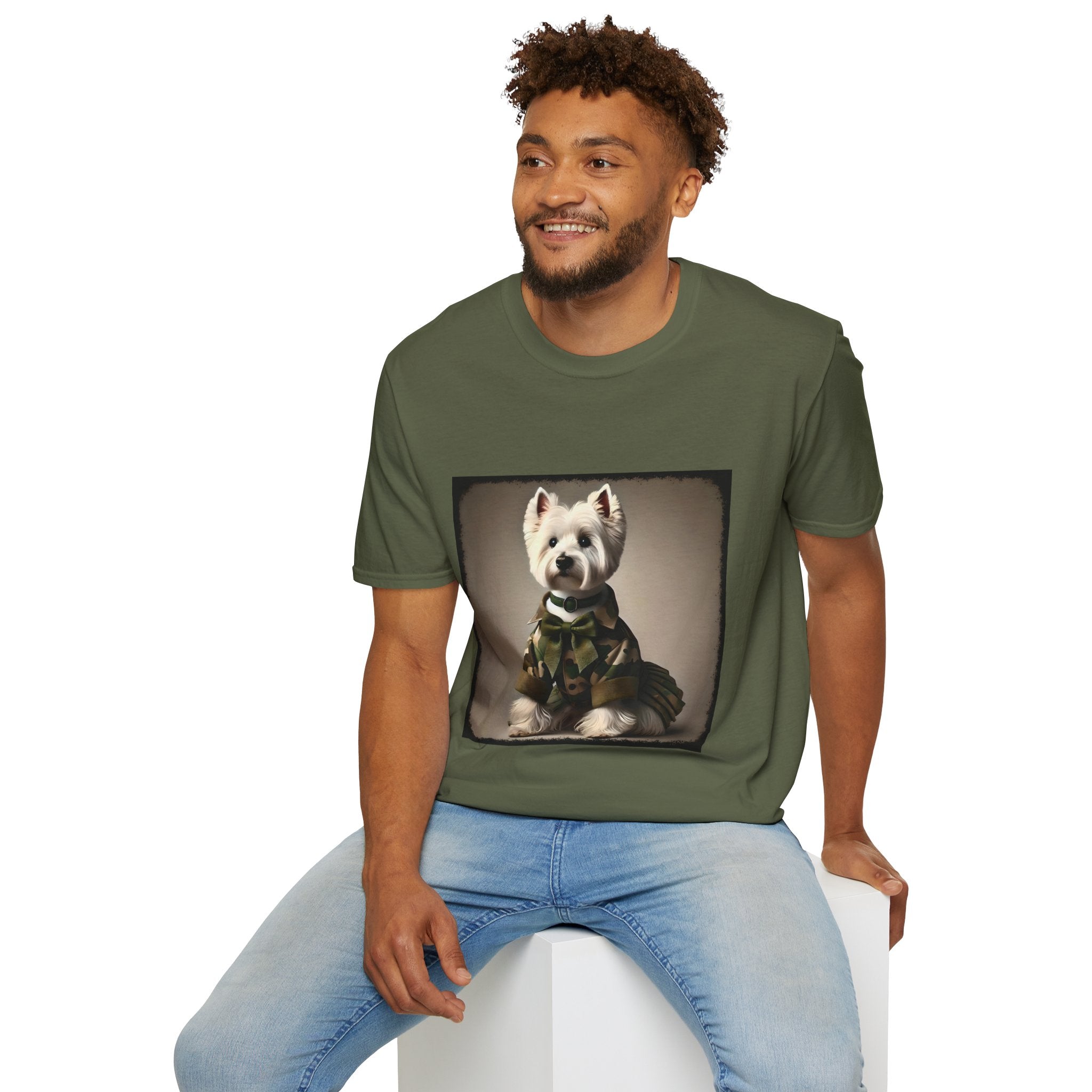 Male model in military green dog t-shirt featuring Westie in camouflage jacket and pleated skirt against neutral backdrop.
