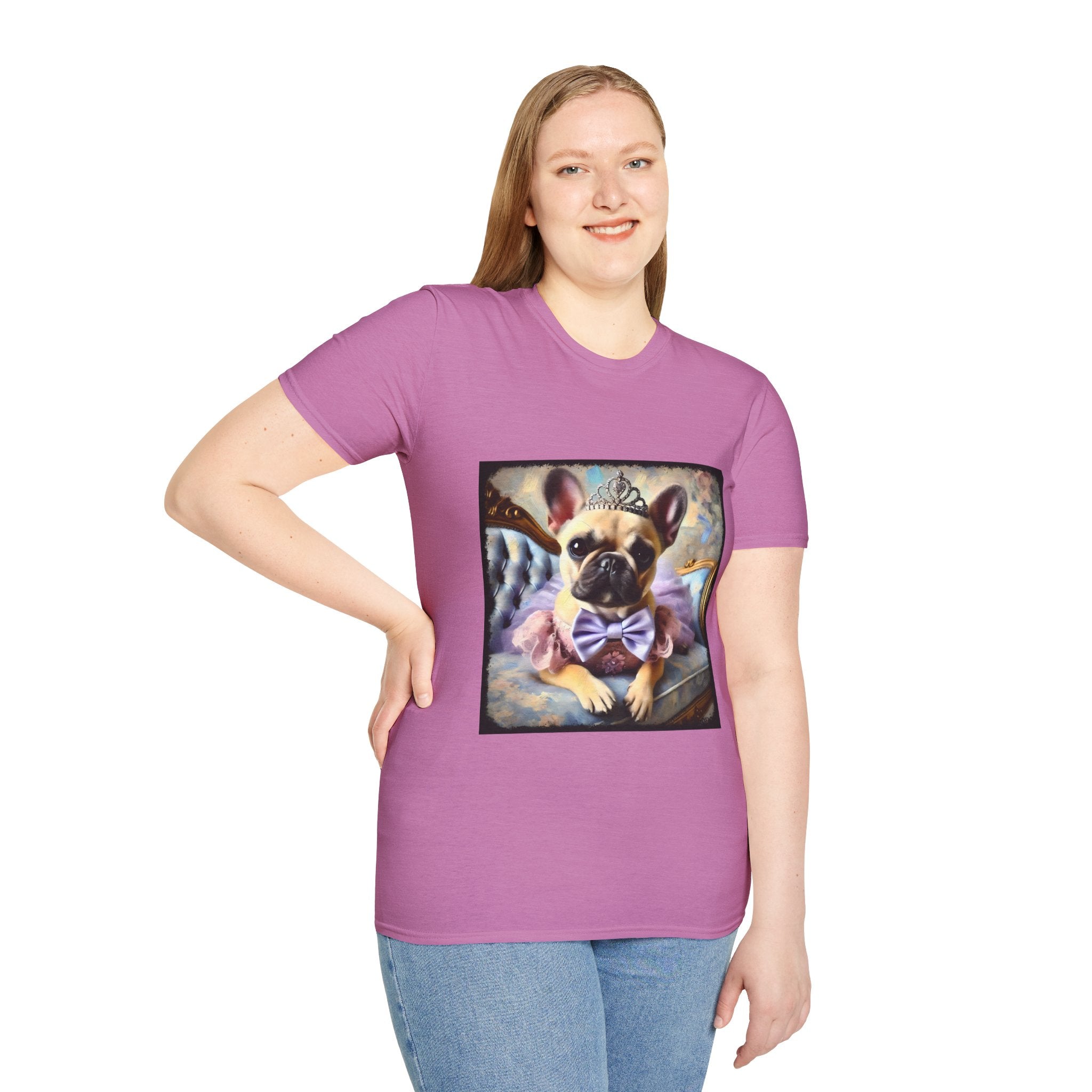 Female model in orchid dog t-shirt featuring French Bulldog in tiara and tutu on royal chair with dreamy pastel background.