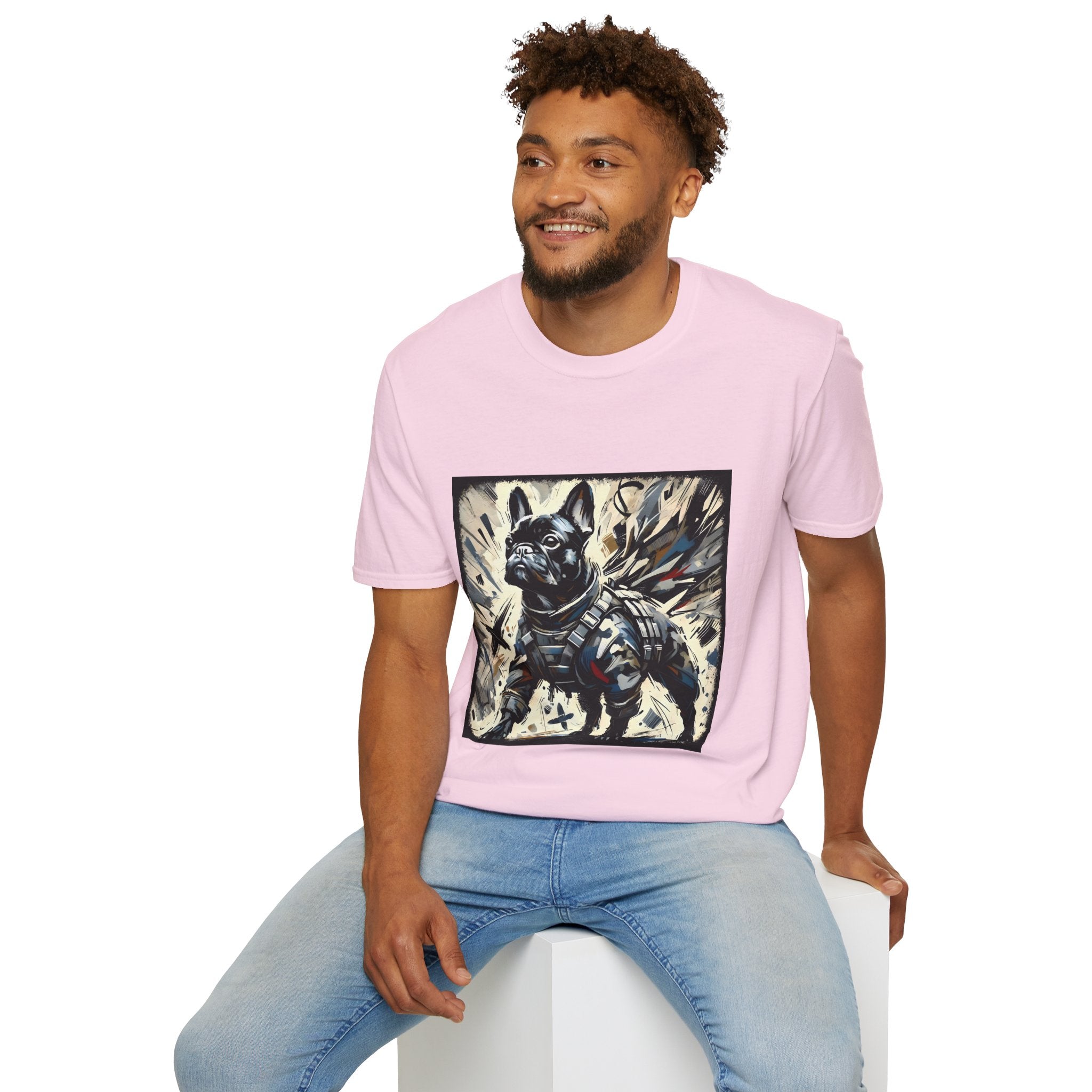 Male model in light pink dog t-shirt featuring heroic black French Bulldog in battle armor, set against abstract explosive strokes.