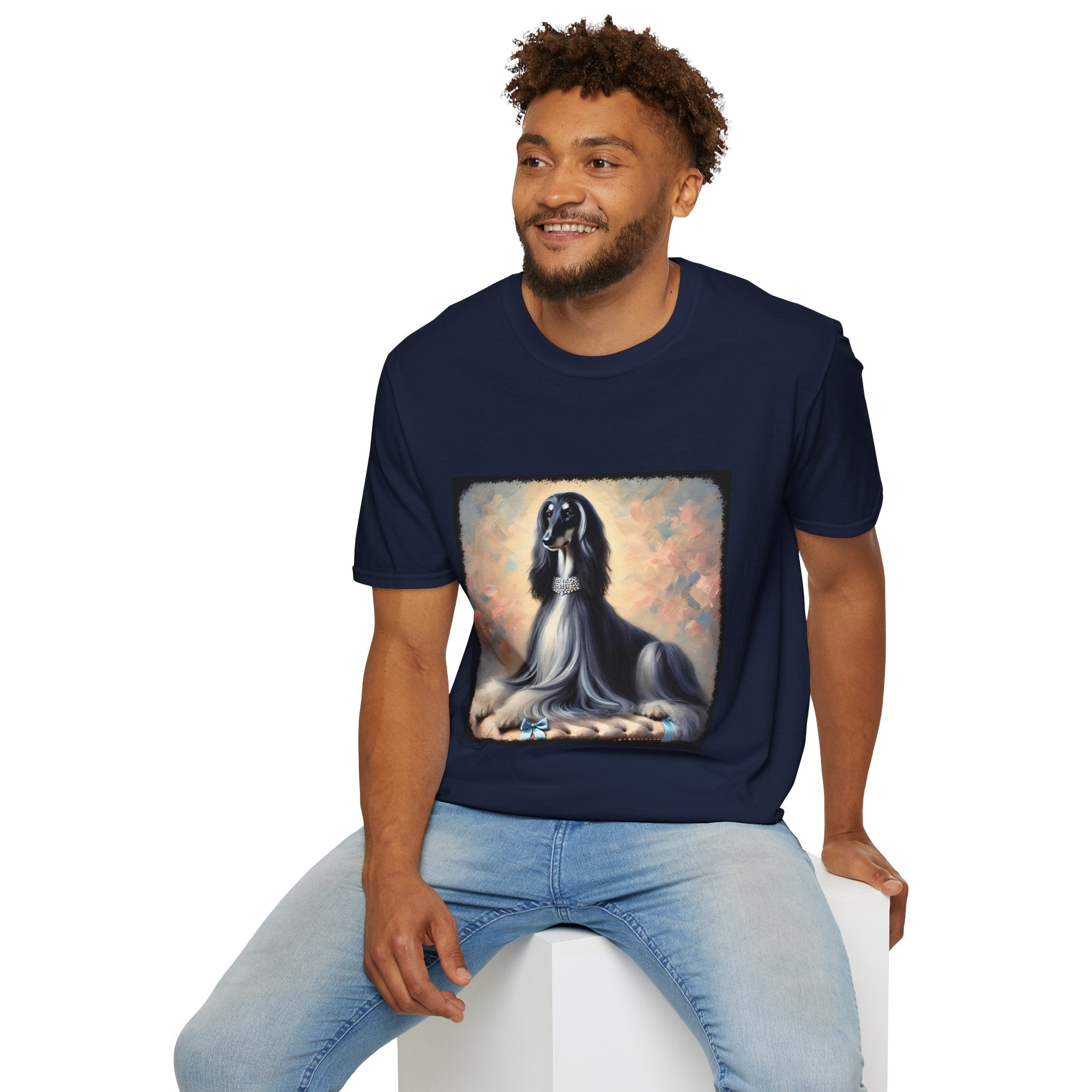 Front view of person wearing navy blue dog t-shirt featuring black and white Afghan Hound on cushion with diamond necklace, pastel background.