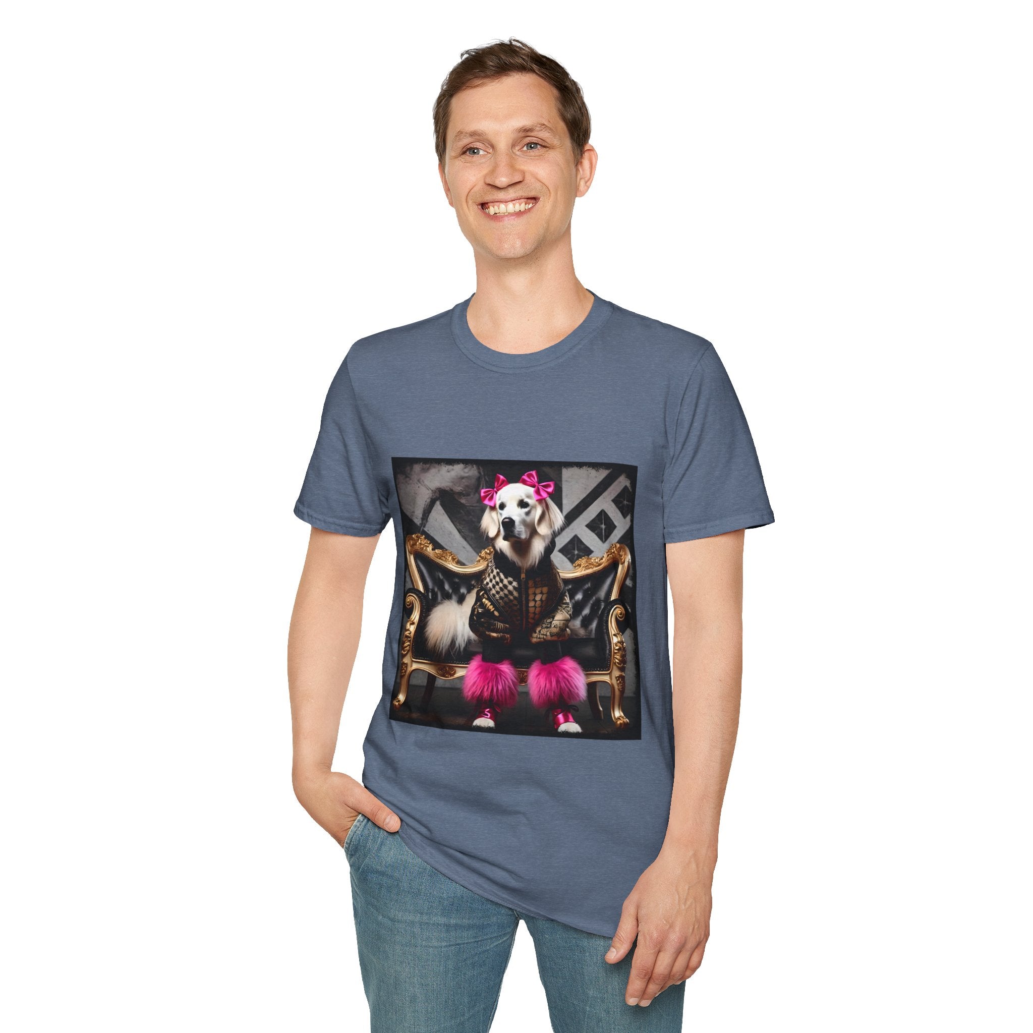 Man smiling in heather indigo dog t-shirt featuring white dog in pink bows and boots on gold settee with edgy gray backdrop.