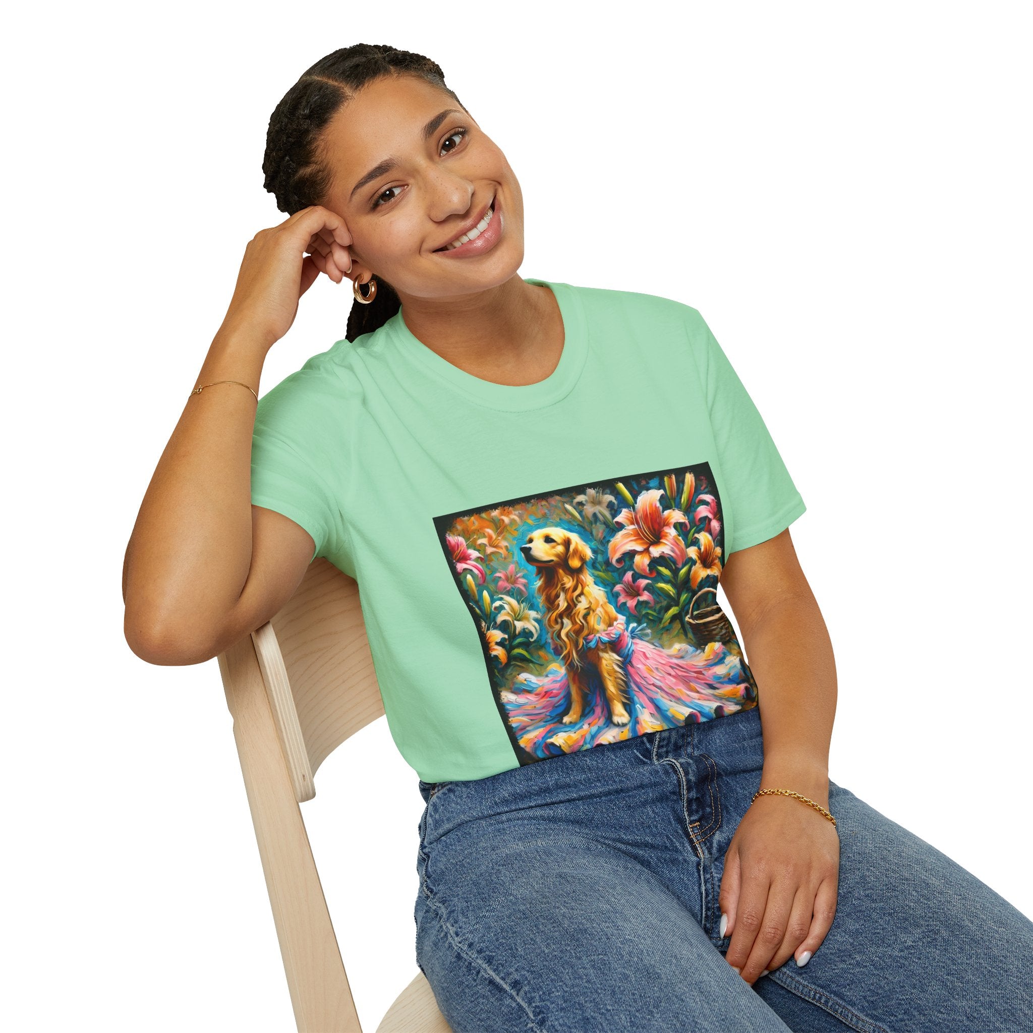 Female model in mint green dog t-shirt featuring golden retriever in pink-and-purple gown surrounded by vibrant tropical flowers.