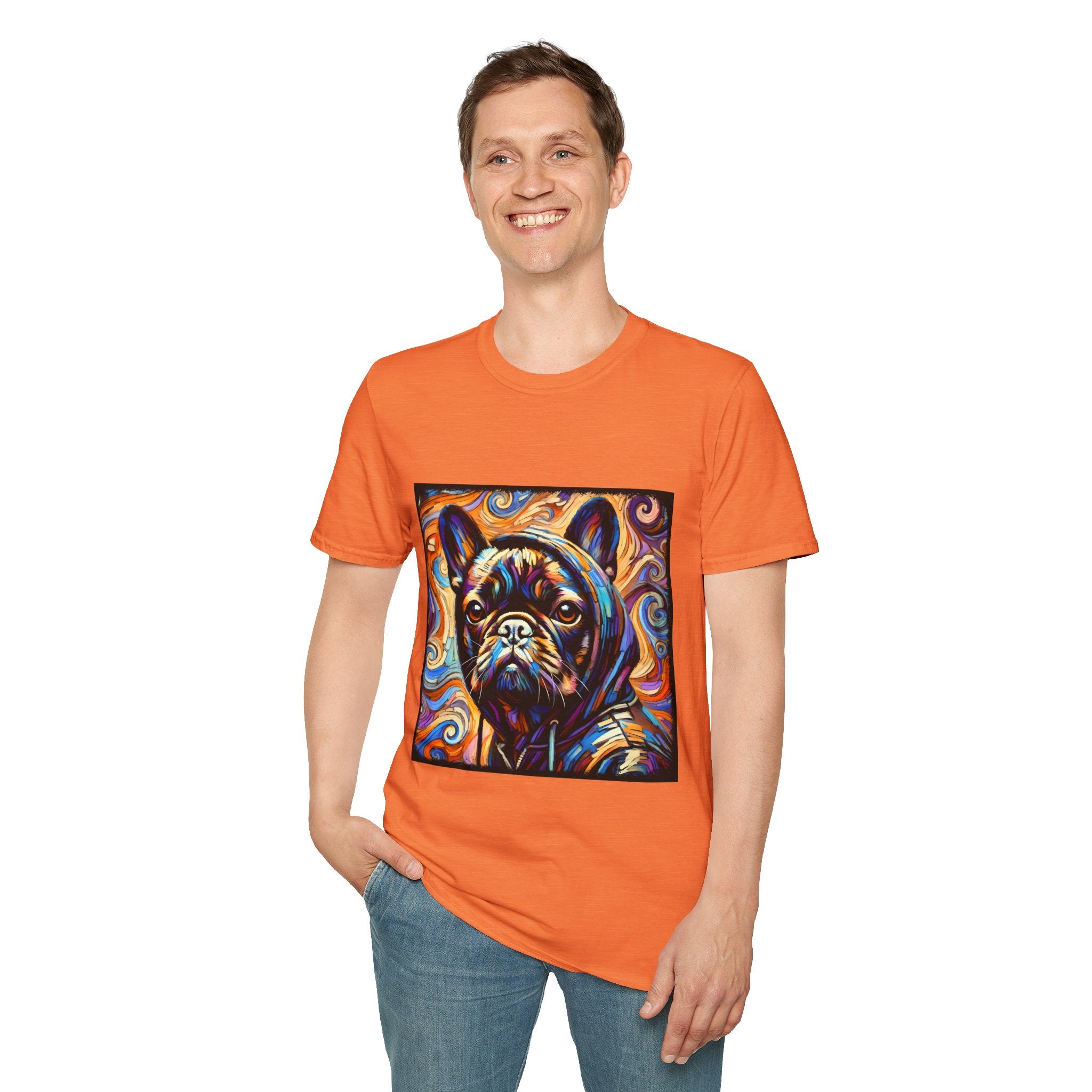 Man smiling in orange dog t-shirt featuring colorful French Bulldog in hoodie with vivid swirl background.