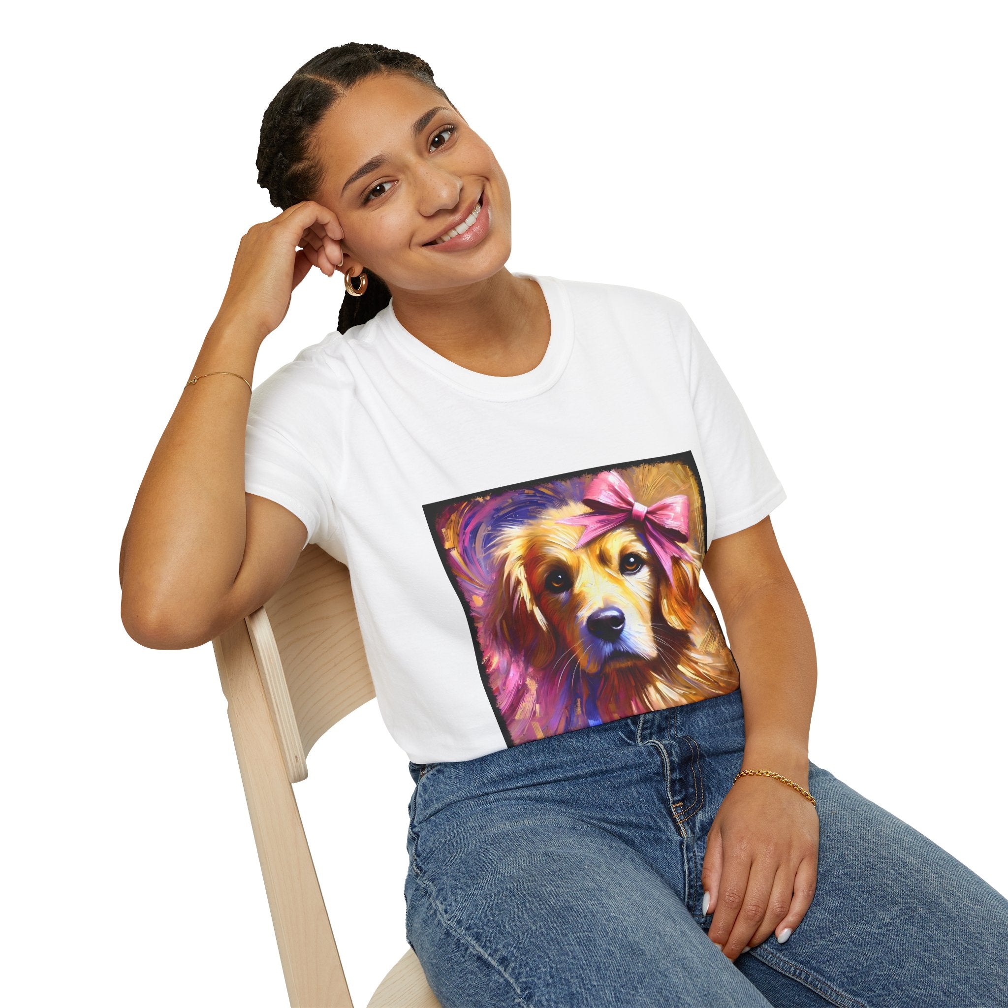 Female model in white dog t-shirt featuring golden retriever with pink bow on head, bold brushstroke background in pinks.