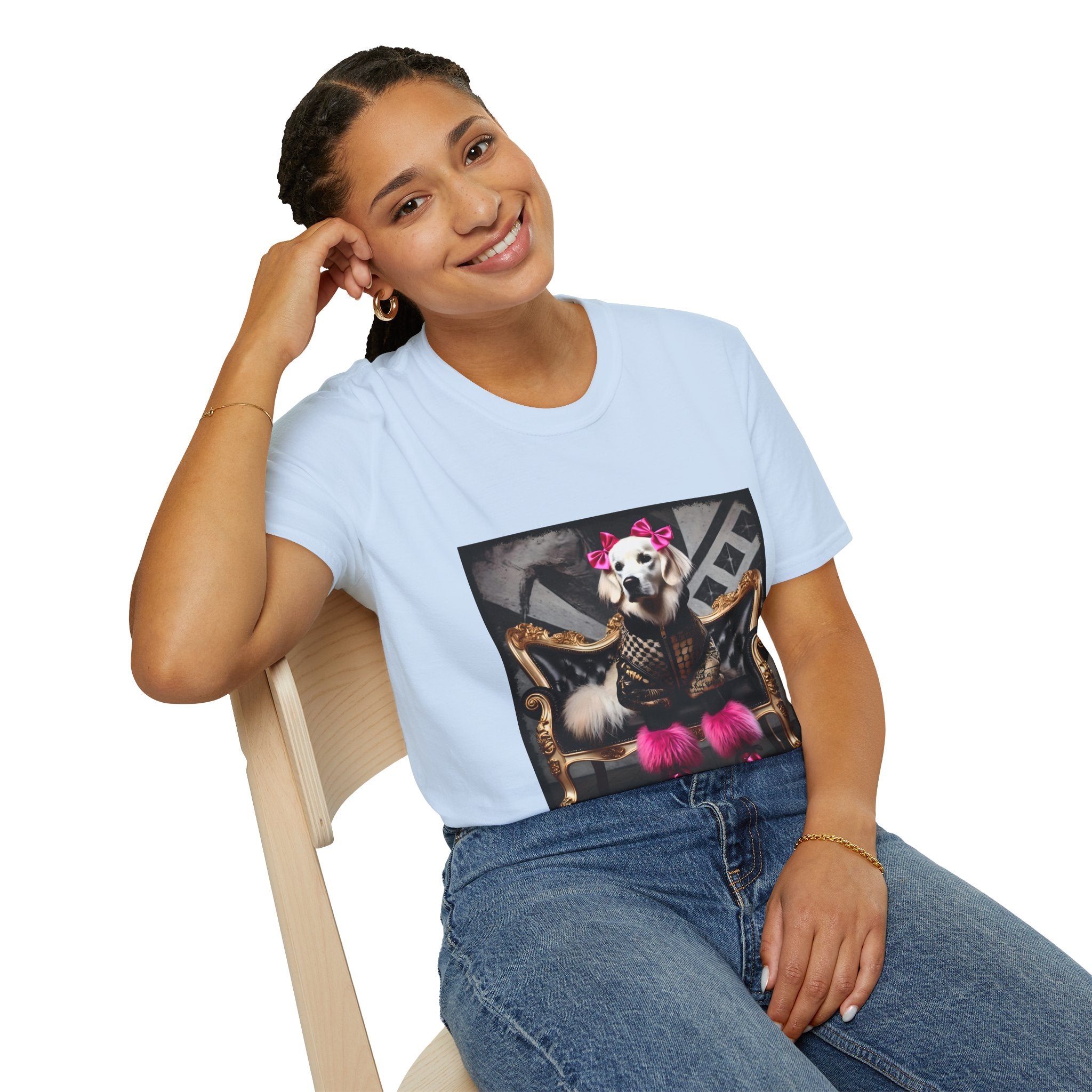 Female sitting in light blue dog t-shirt featuring white dog in pink bows and boots on gold settee with edgy gray backdrop.