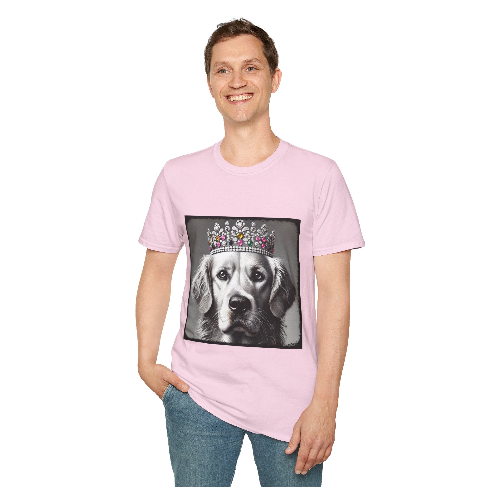 Male model wears light pink dog t-shirt featuring a black-and-white princess Golden Retriever with jeweled crown on gray background.