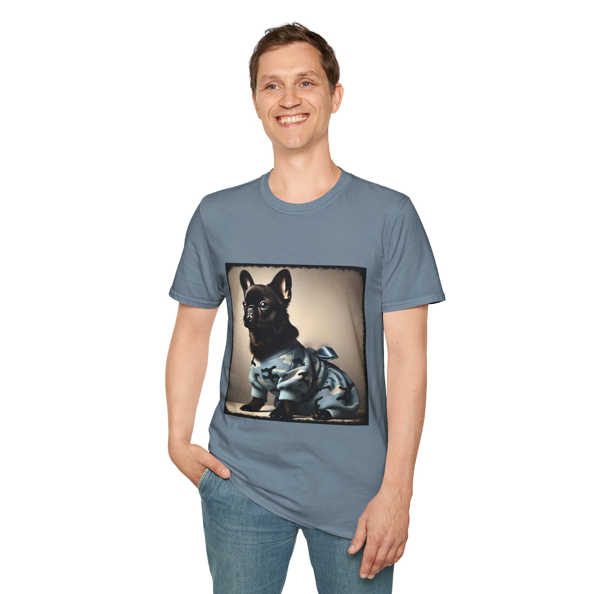 Man smiling wearing stone blue dog t-shirt featuring black French Bulldog in blue camo outfit with bow, set in soft vintage portrait.