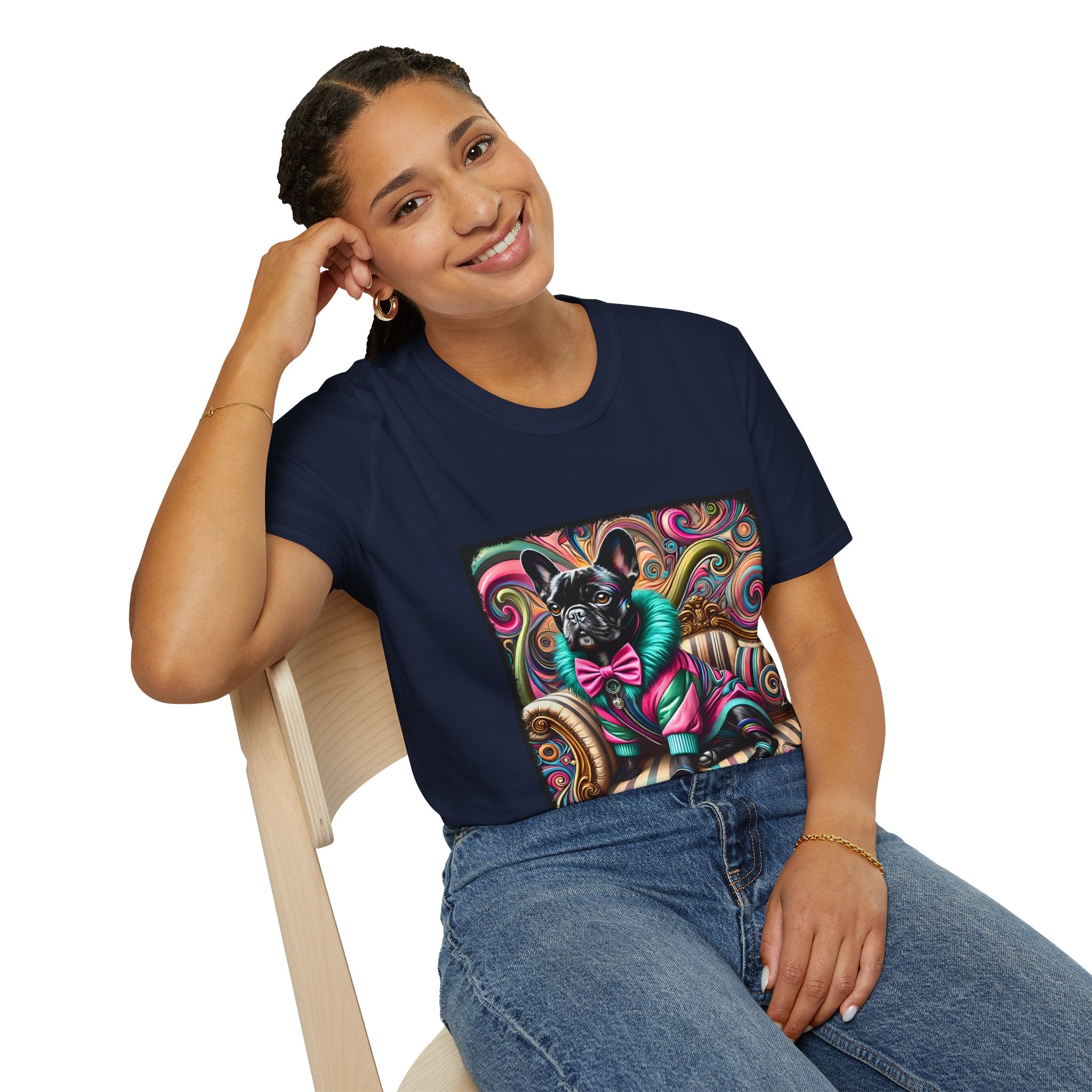 Woman sitting in navy blue dog t-shirt with black French Bulldog in pink and teal outfit on swirl background and settee.