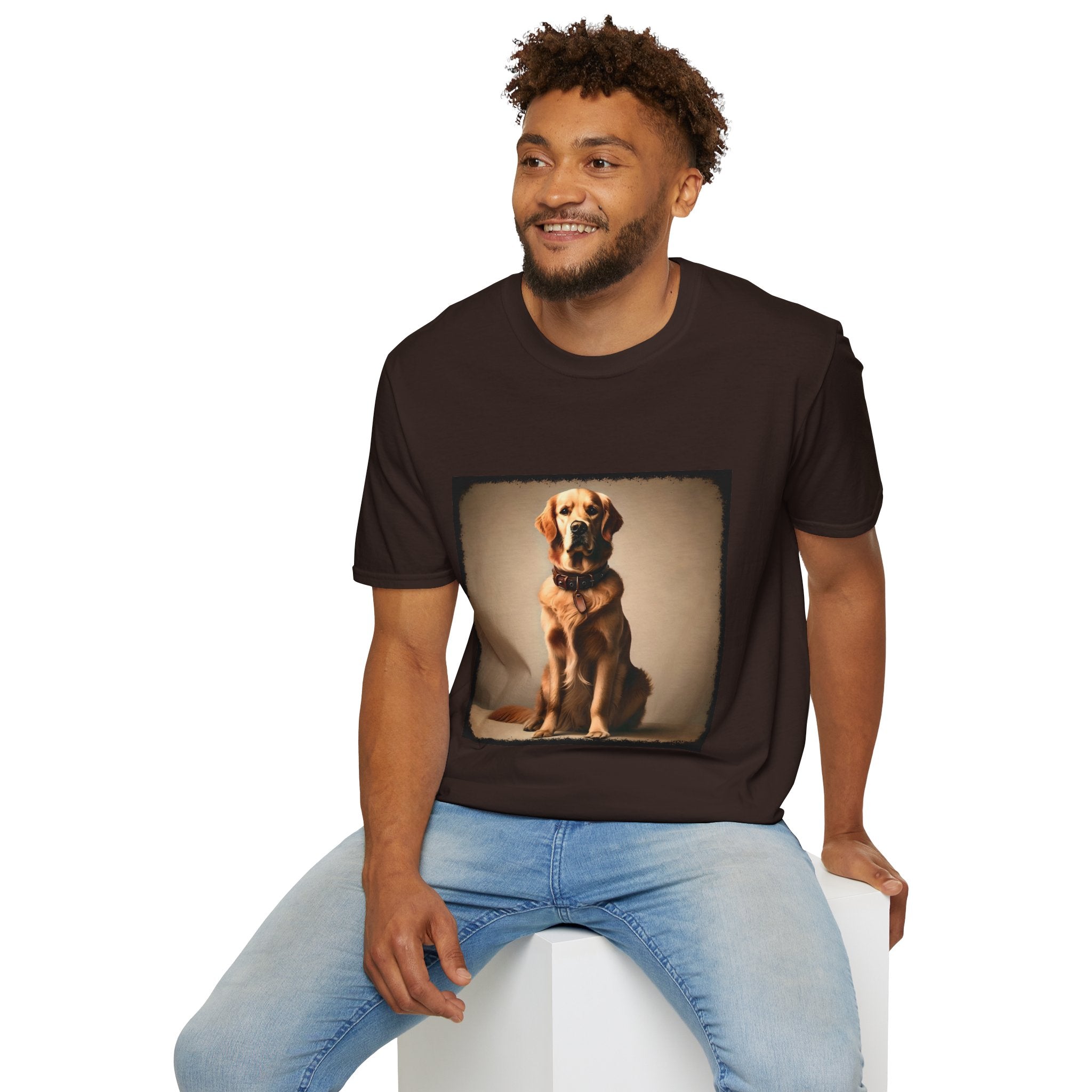 Male model in dark chocolate dog t-shirt featuring golden retriever in brown collar, seated against a neutral tan backdrop.