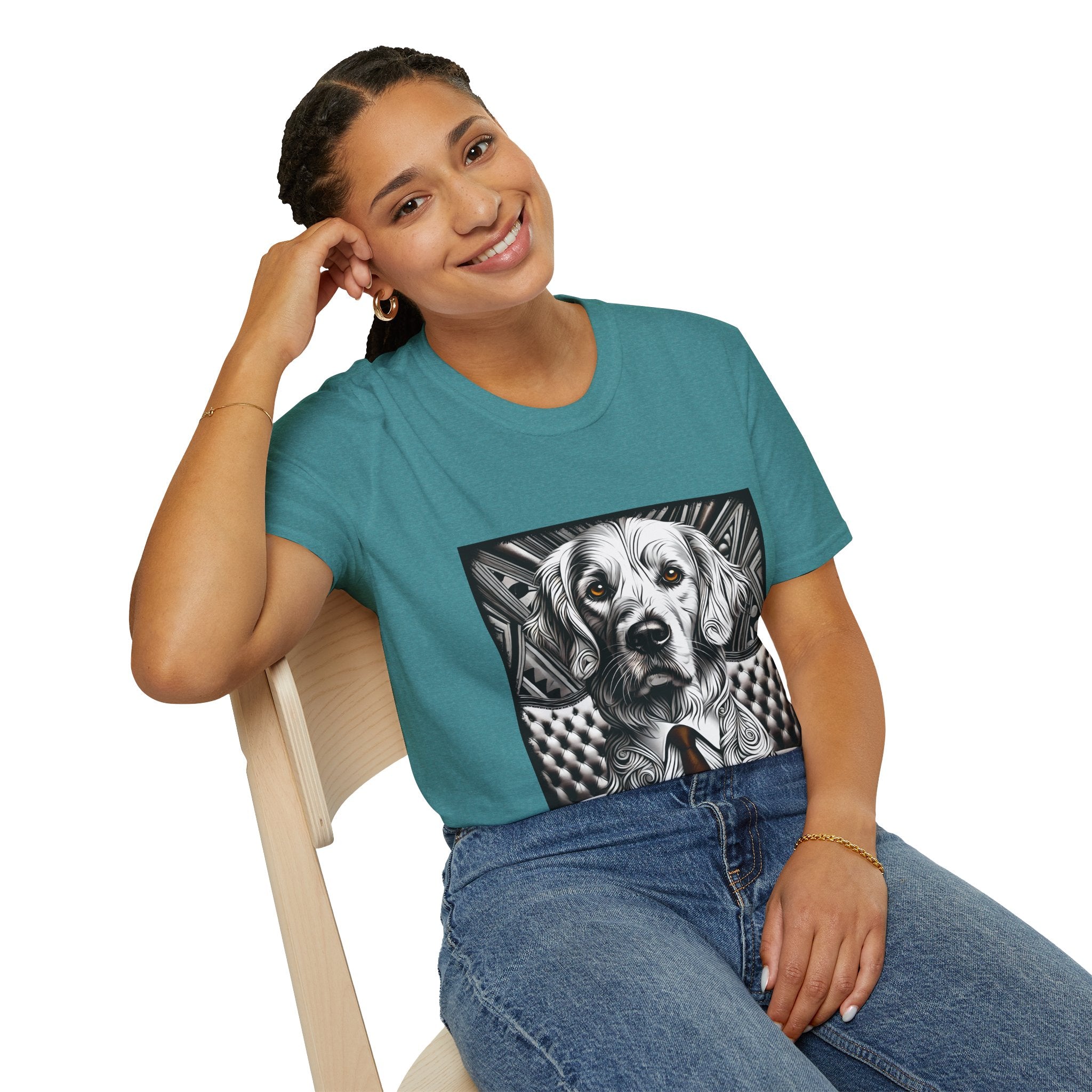 Female sitting in teal dog t-shirt featuring monochrome golden retriever with brown eyes and tie in front of settee.