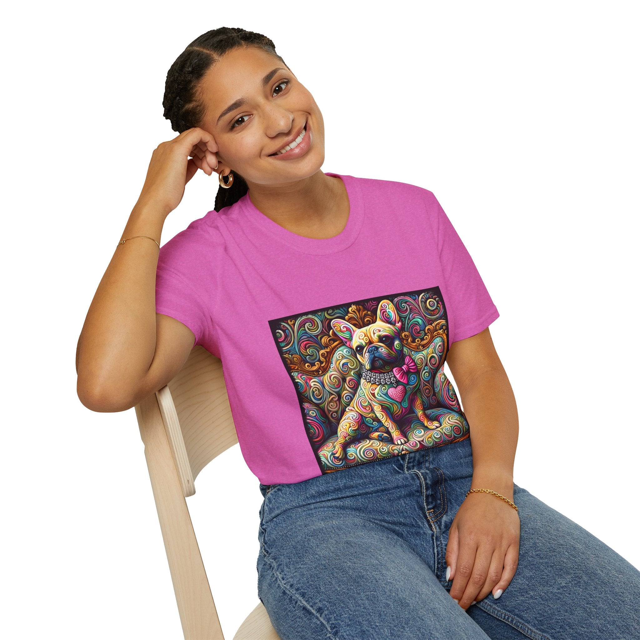 Woman sitting in orchid pink dog t-shirt featuring a tan French Bulldog with pink bow and heart on a vivid rainbow swirl couch.