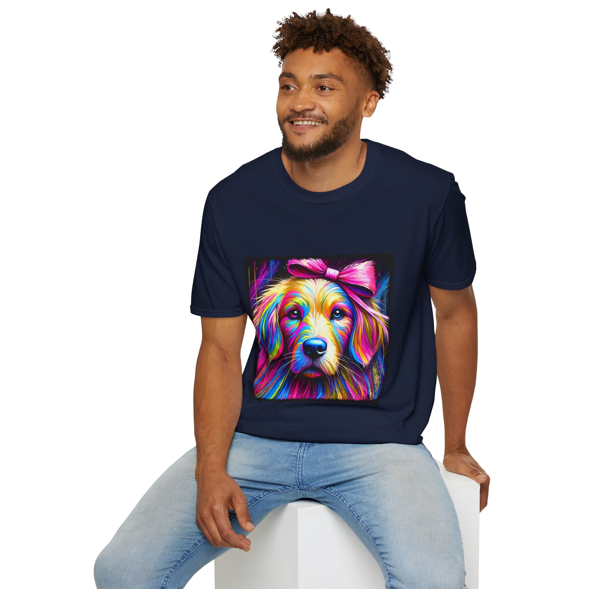 Male model in navy dog t-shirt featuring neon-colored golden retriever with pink bow on vibrant electric abstract backdrop.