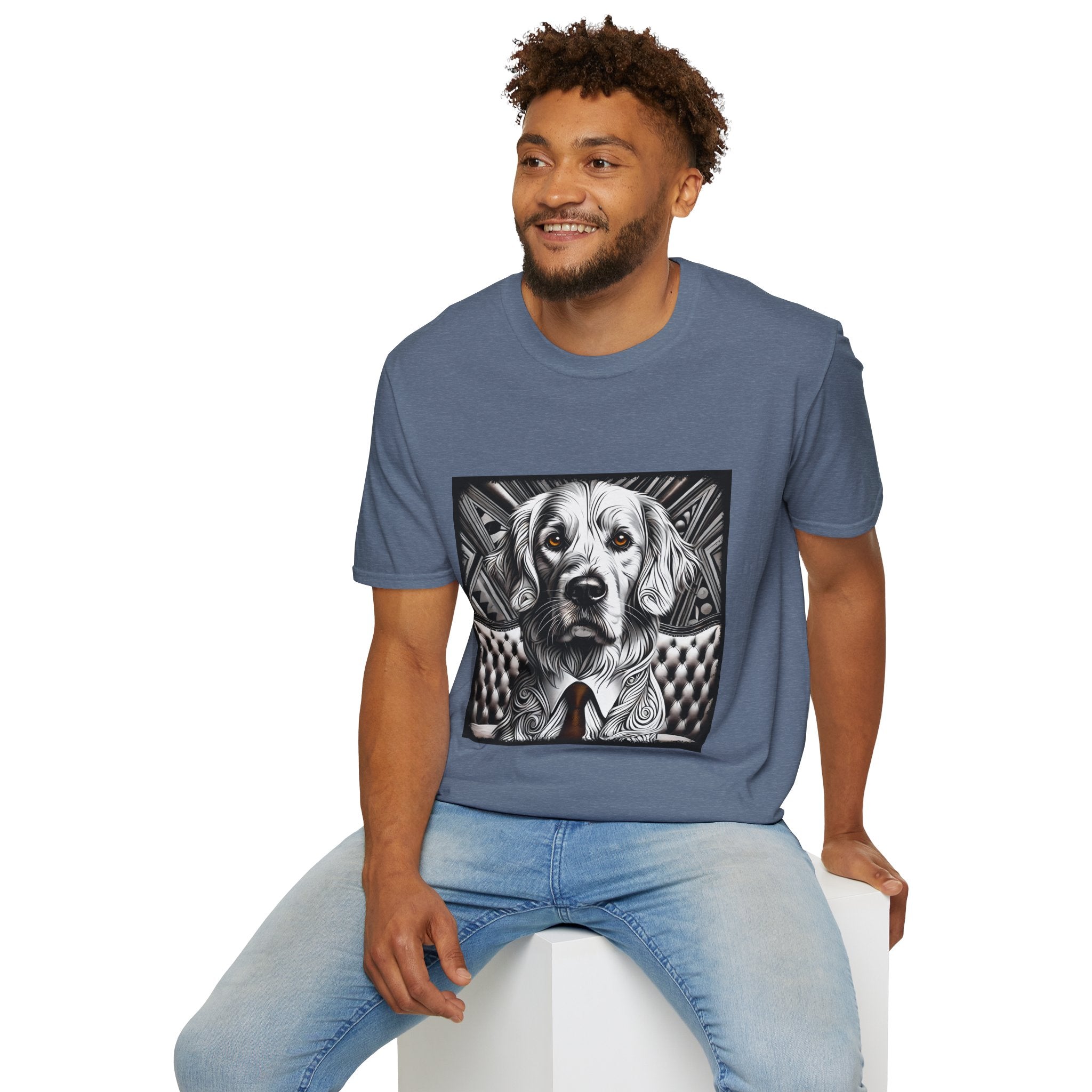 Male model in heather indigo dog t-shirt featuring monochrome golden retriever with brown eyes and tie in front of settee.