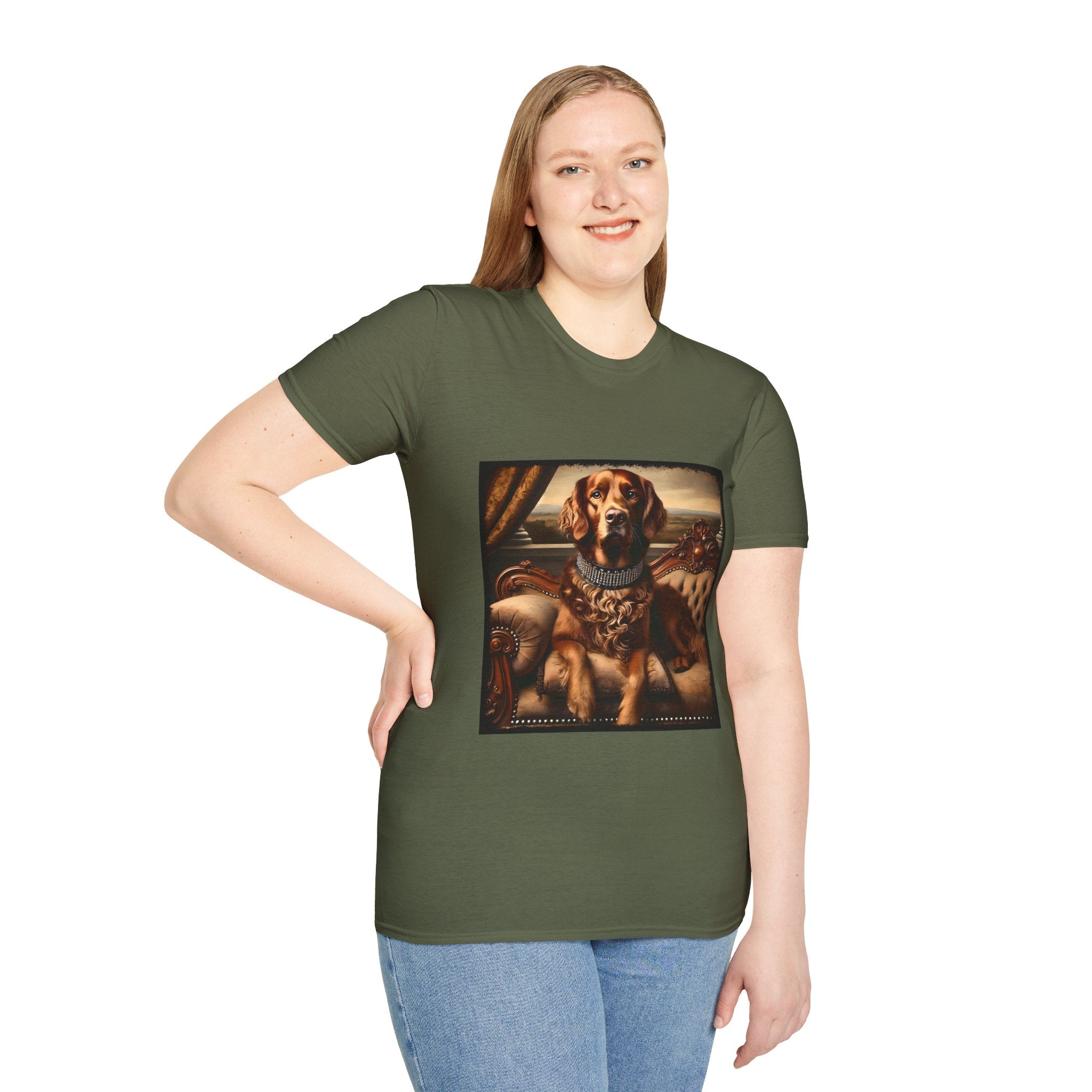 Female model wears military green dog t-shirt featuring a chocolate brown golden retriever in a jeweled collar, seated on a vintage tufted settee.