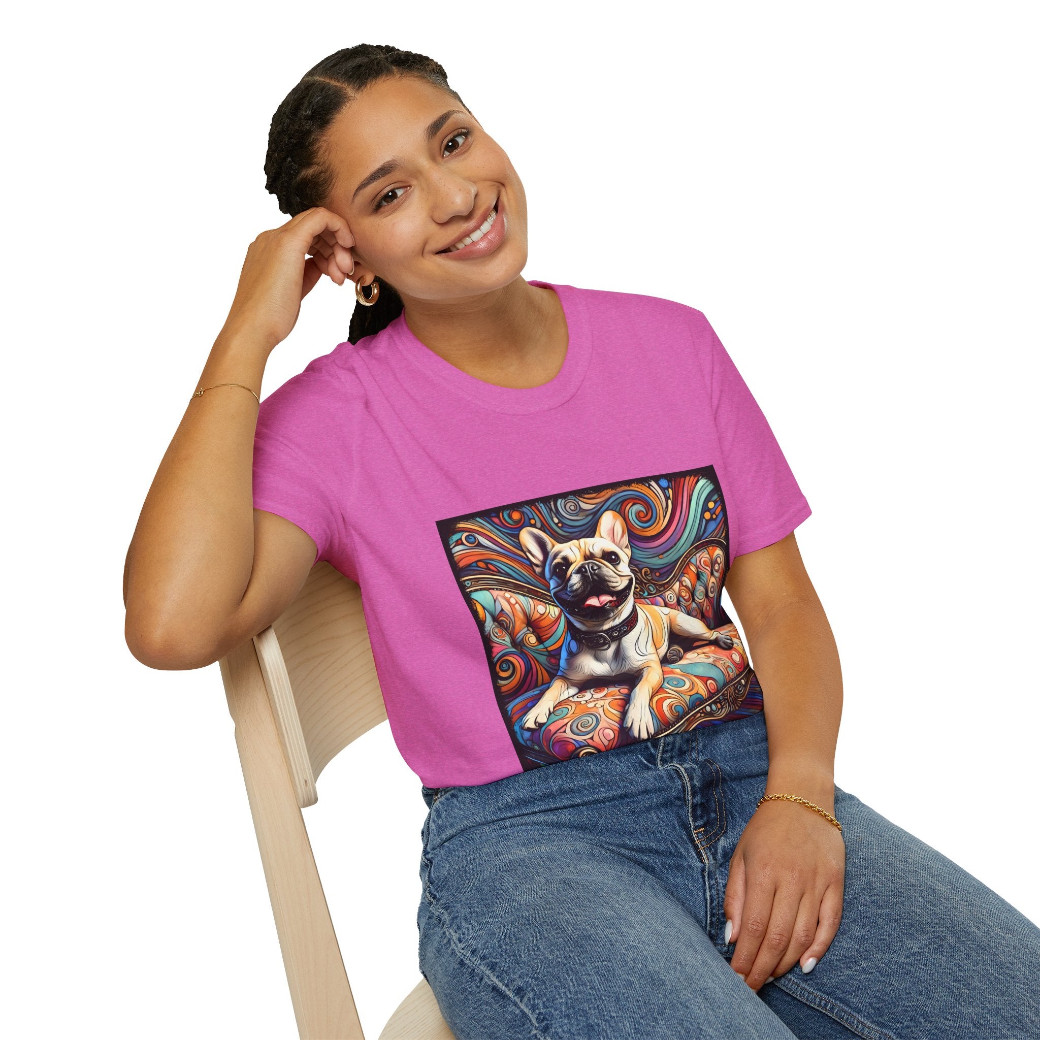 Woman sitting in pink orchid dog t-shirt featuring fawn French Bulldog on swirl settee with vivid, colorful background.
