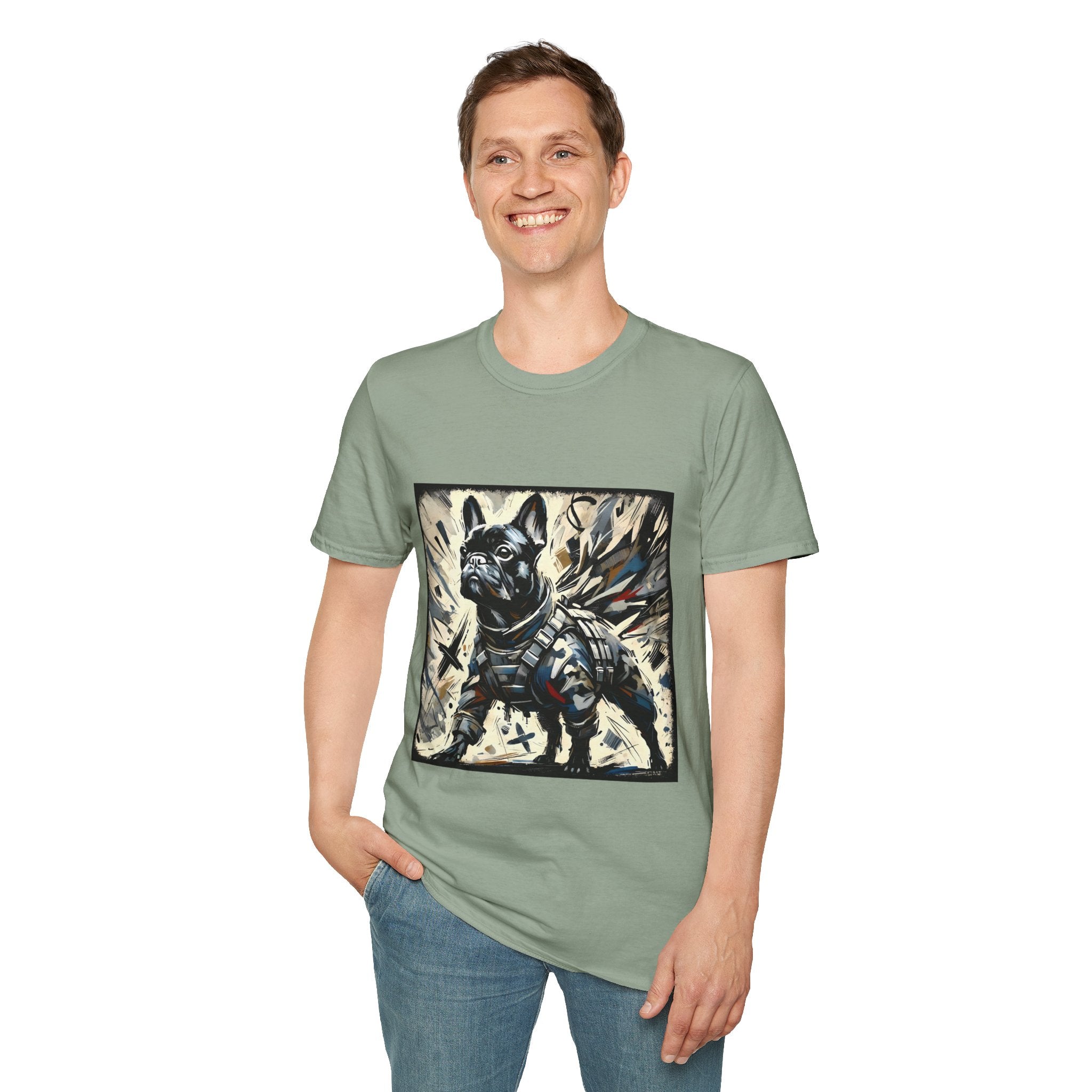 Man smiling in sage green dog t-shirt featuring heroic black French Bulldog in battle armor, set against abstract explosive strokes.
