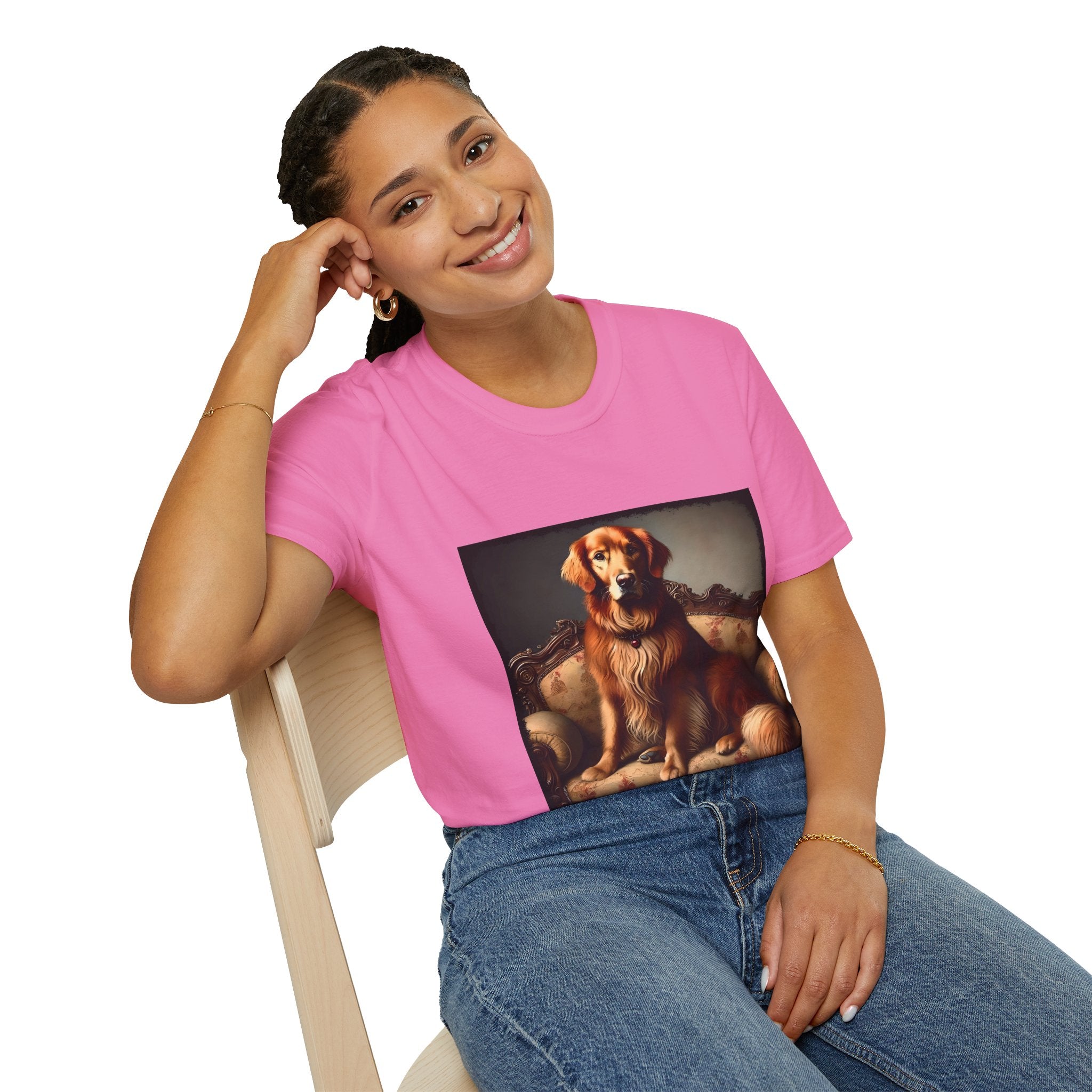 Female model in pink dog t-shirt featuring golden retriever on ornate settee with long fur and classic red tones.