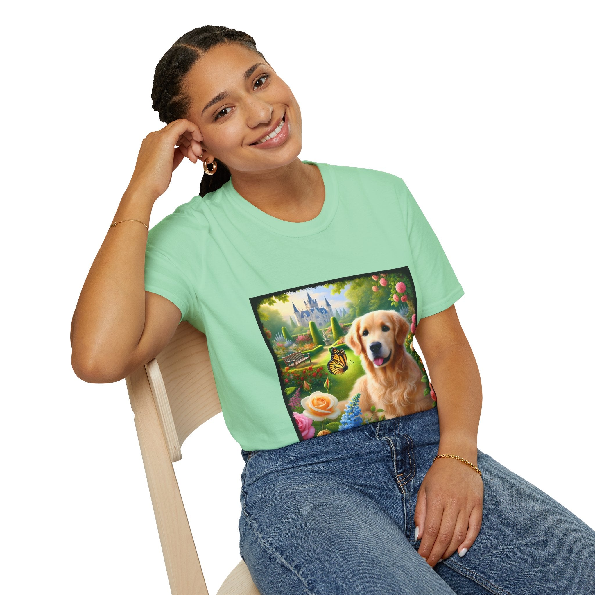 Female model wears mint green dog t-shirt featuring a golden retriever in a vibrant castle garden with blooming roses and a butterfly.