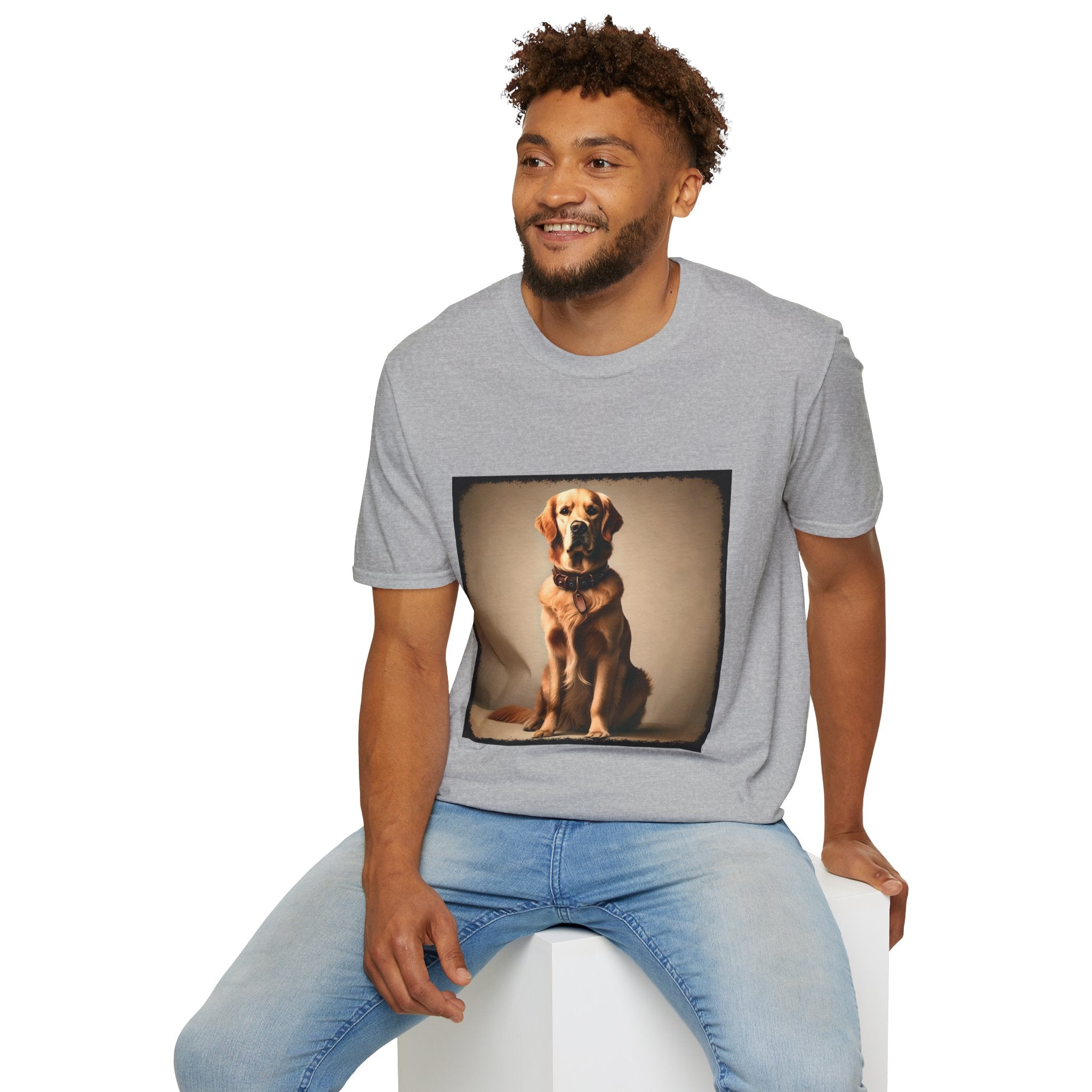 Male model in sport gray dog t-shirt featuring golden retriever in brown collar, seated against a neutral tan backdrop.