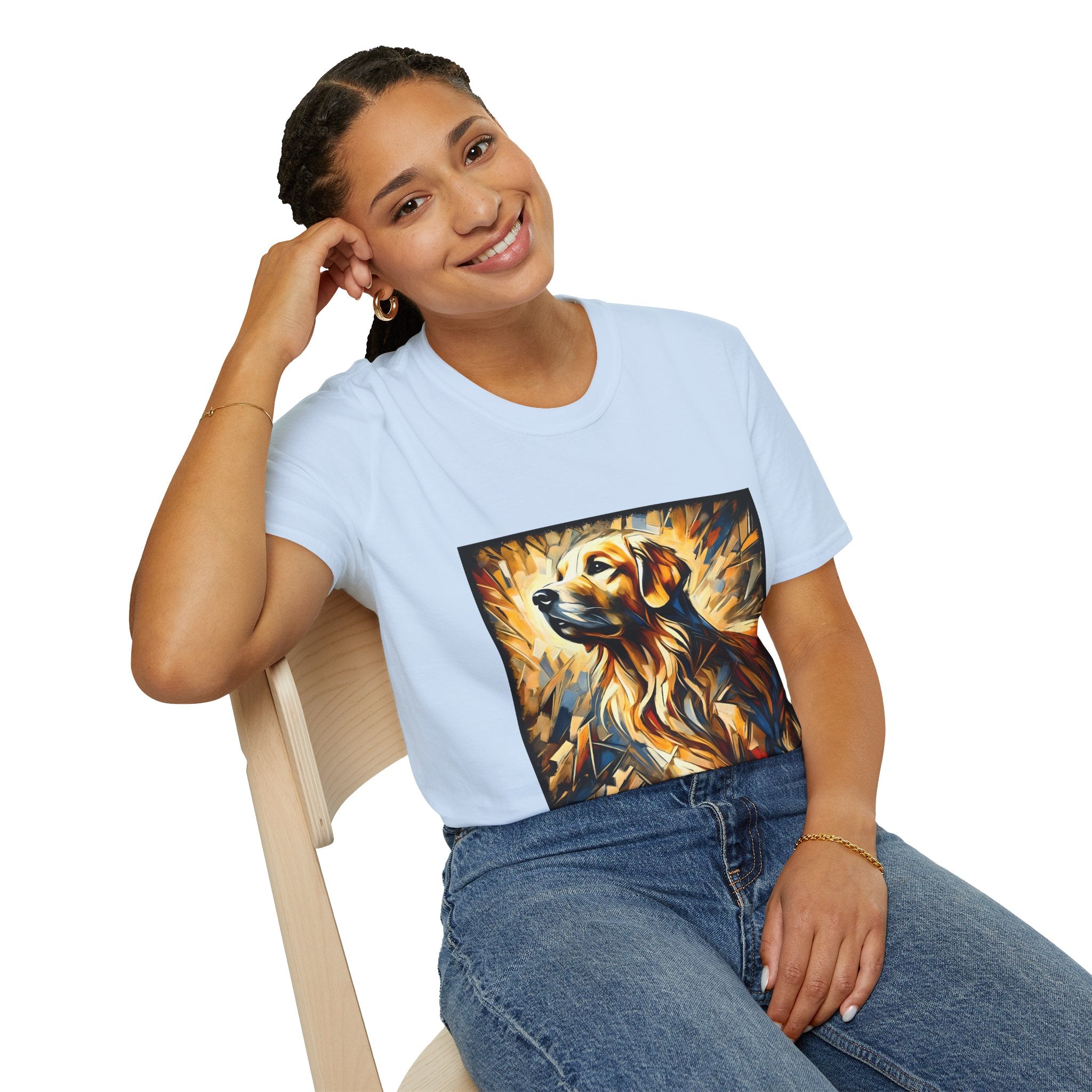 Female sitting in light blue dog t-shirt featuring golden retriever portrait with fiery gold, blue, and amber abstract swirls.