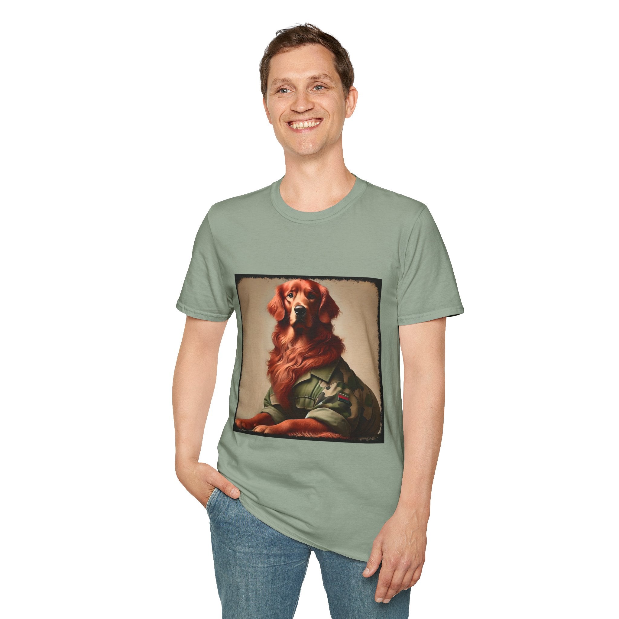 Male model in sage green dog t-shirt featuring golden retriever in camouflage jacket with flag patch, tan background.