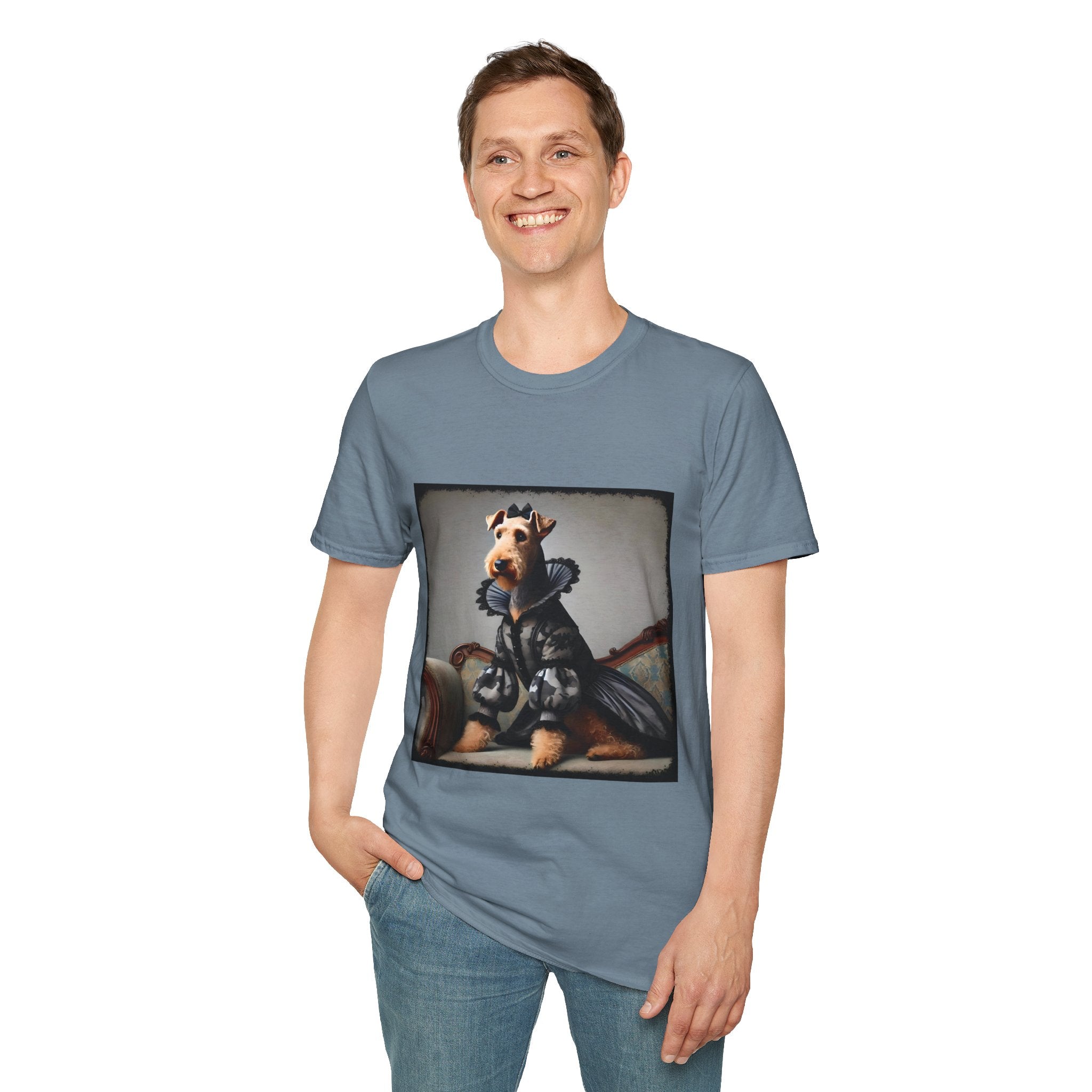 Male standing in stone blue dog t-shirt featuring Airedale terrier in camouflage Renaissance gown seated on settee.