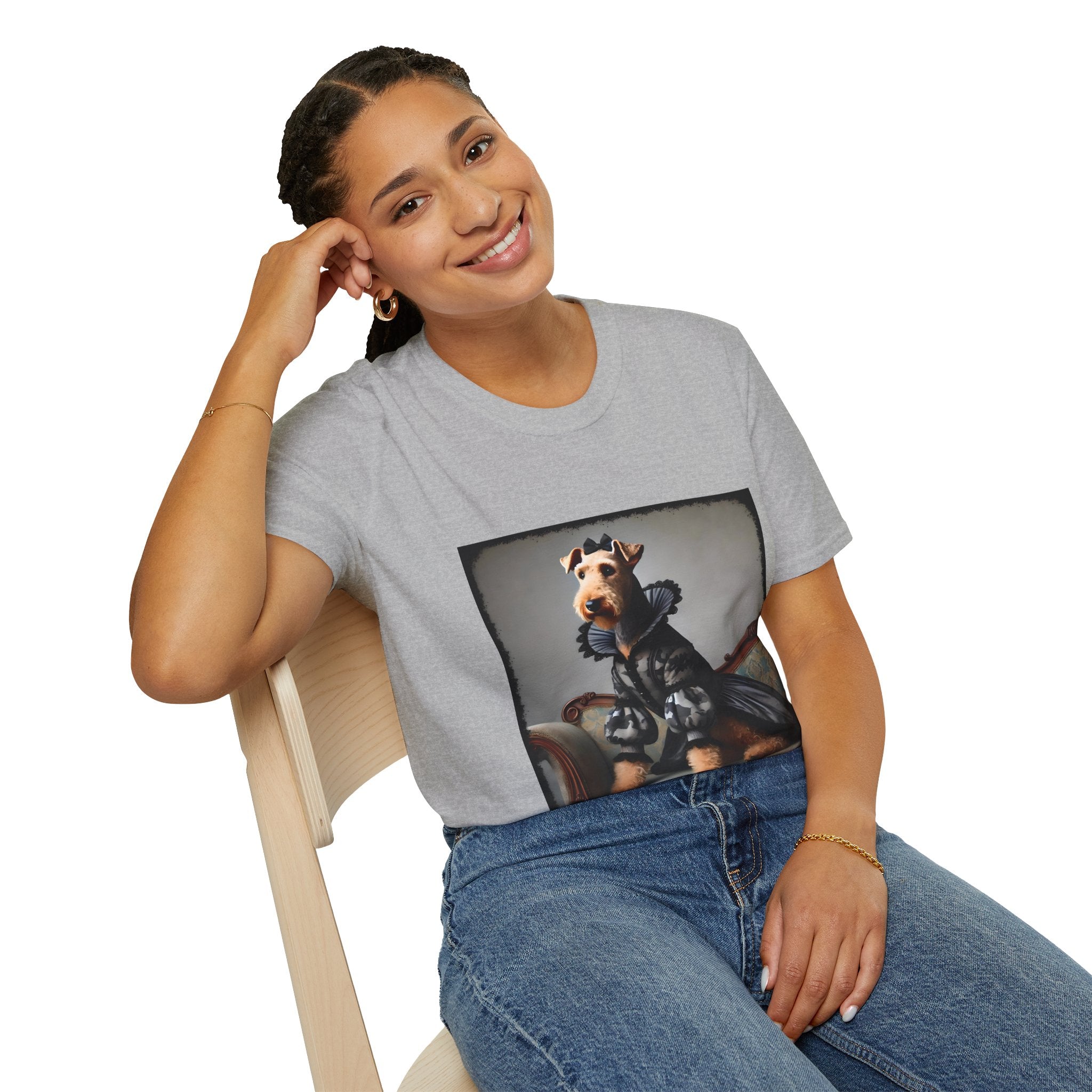 Female sitting in sport gray dog t-shirt featuring Airedale terrier in camouflage Renaissance gown seated on settee.