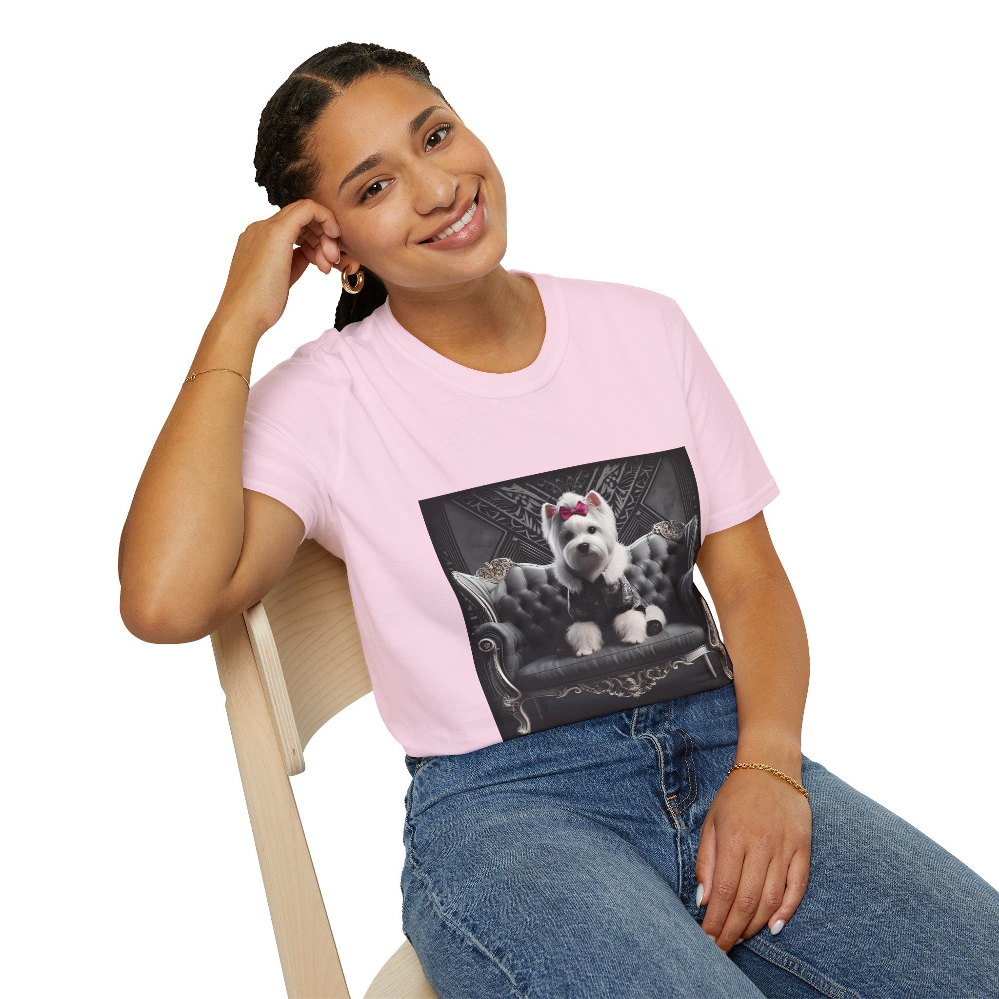 Female model in light pink dog t-shirt featuring Westie in black outfit with pink bow seated on ornate gothic black couch.