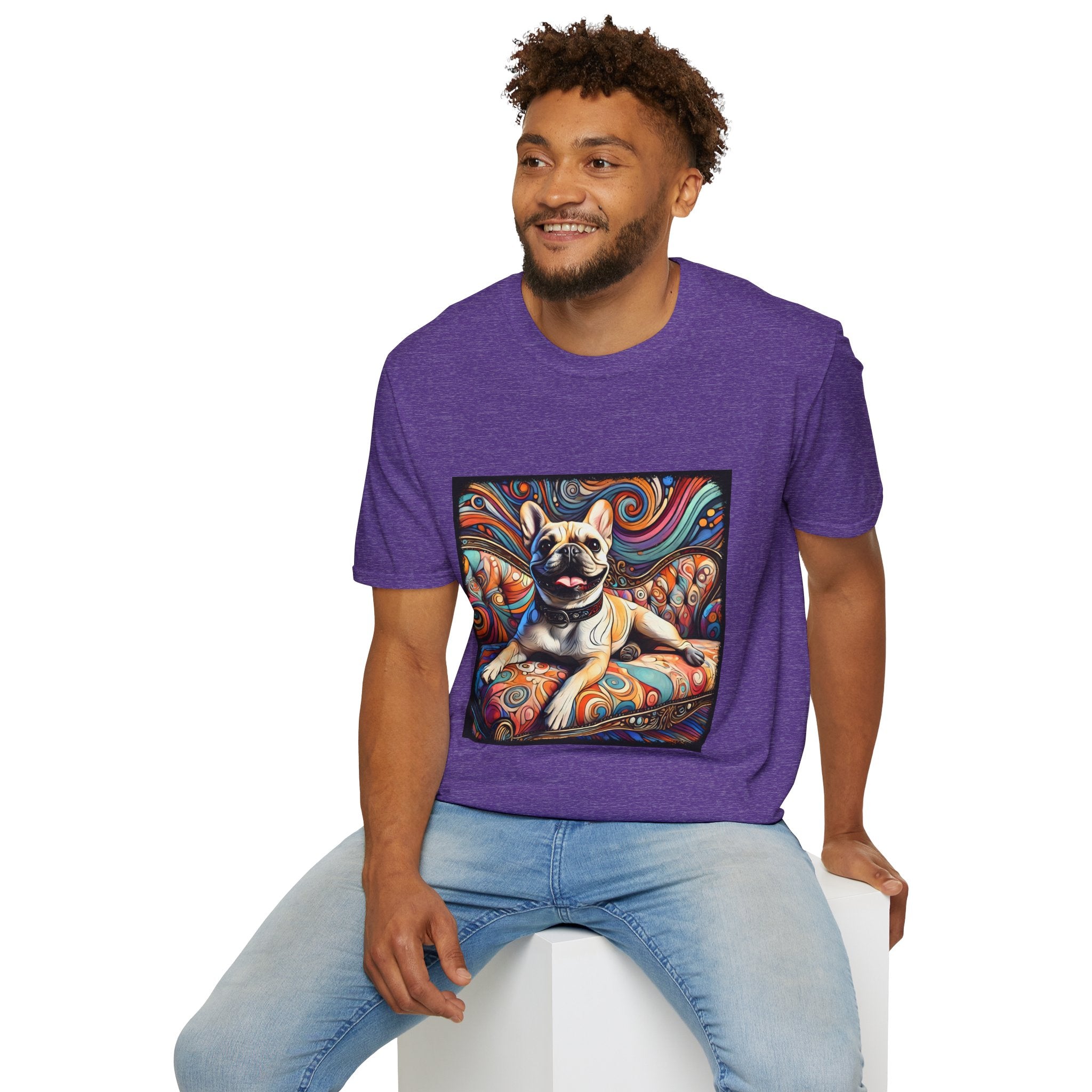 Male model in heather purple dog t-shirt featuring fawn French Bulldog with collar on swirl settee and vivid background.