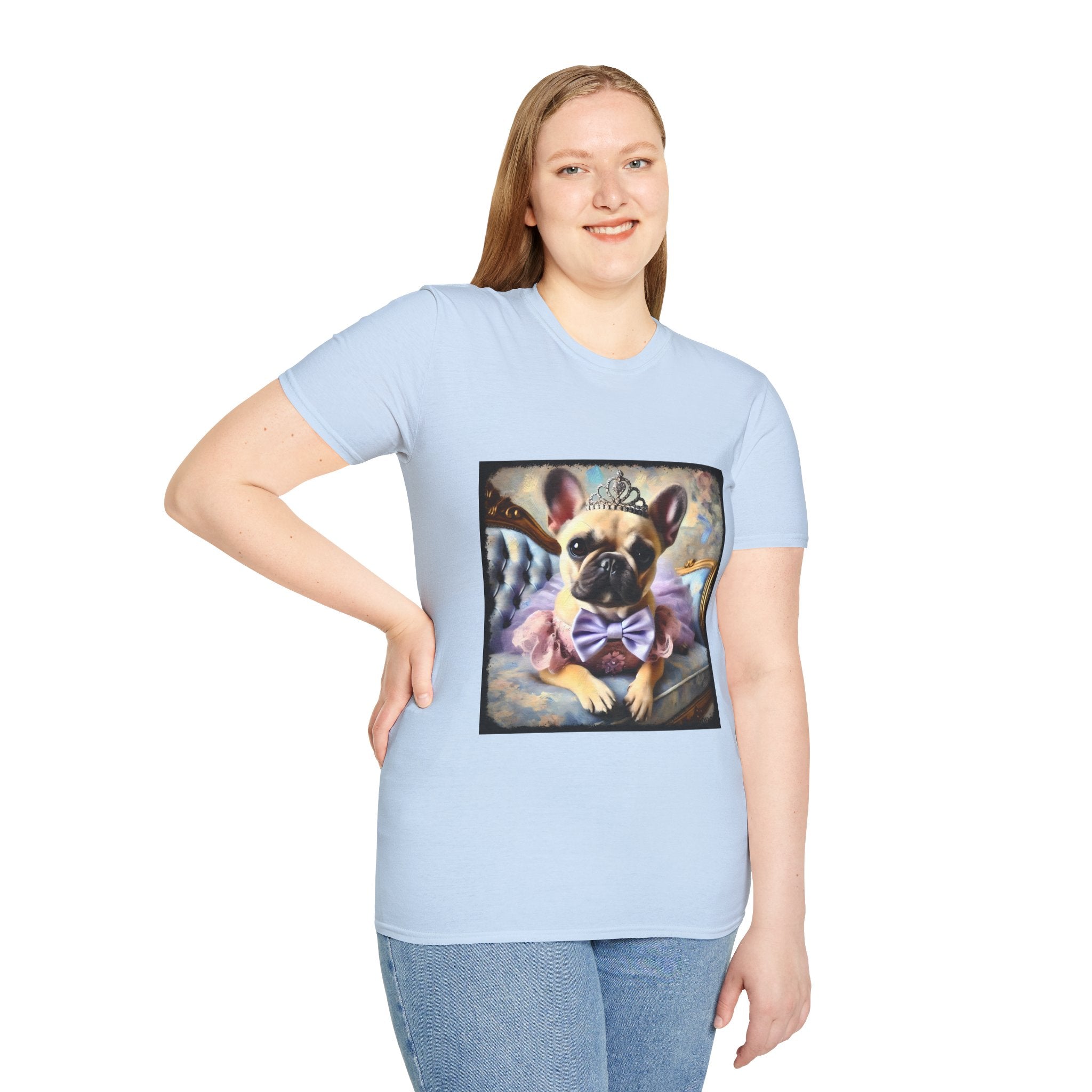 Female model light blue dog t-shirt featuring French Bulldog in tiara and tutu on royal chair with dreamy pastel background.