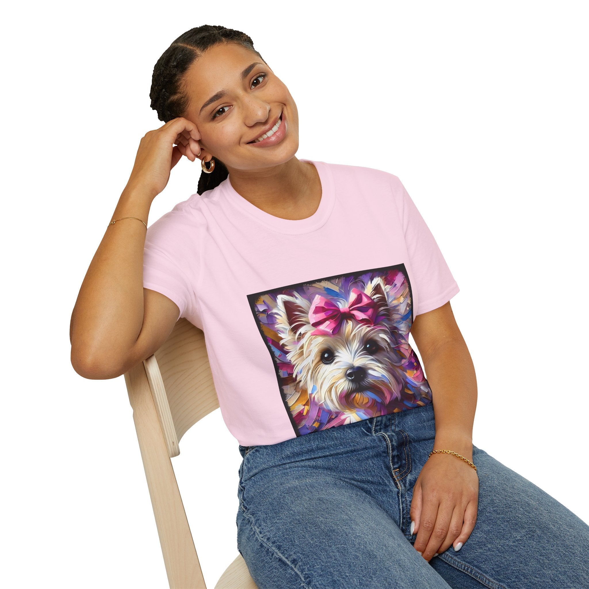 Female model in light pink dog t-shirt with Westie face, pink bow, and bold brushstroke colors in purple, pink, and gold.