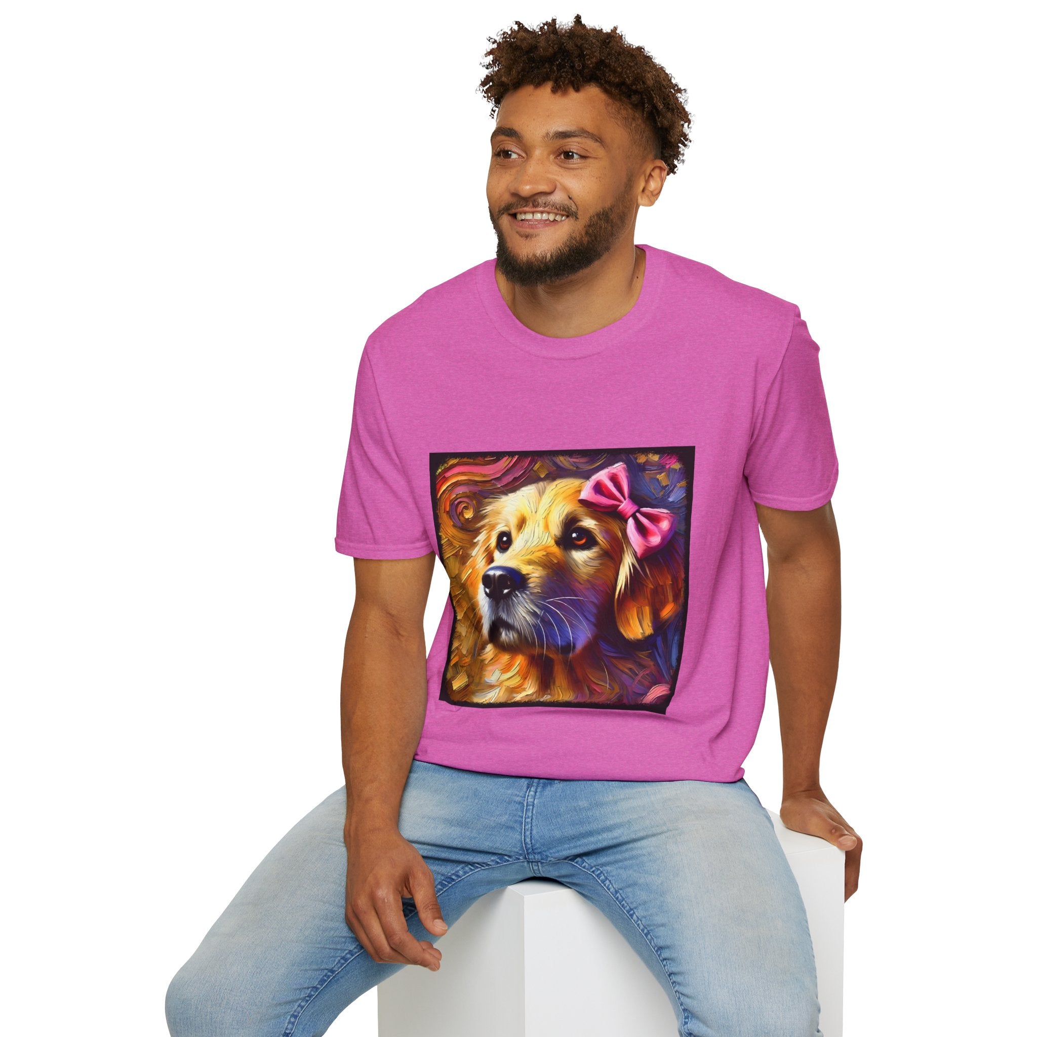 Male model in bright pink dog t-shirt featuring golden retriever with pink bow on head, set against vivid painterly swirls.