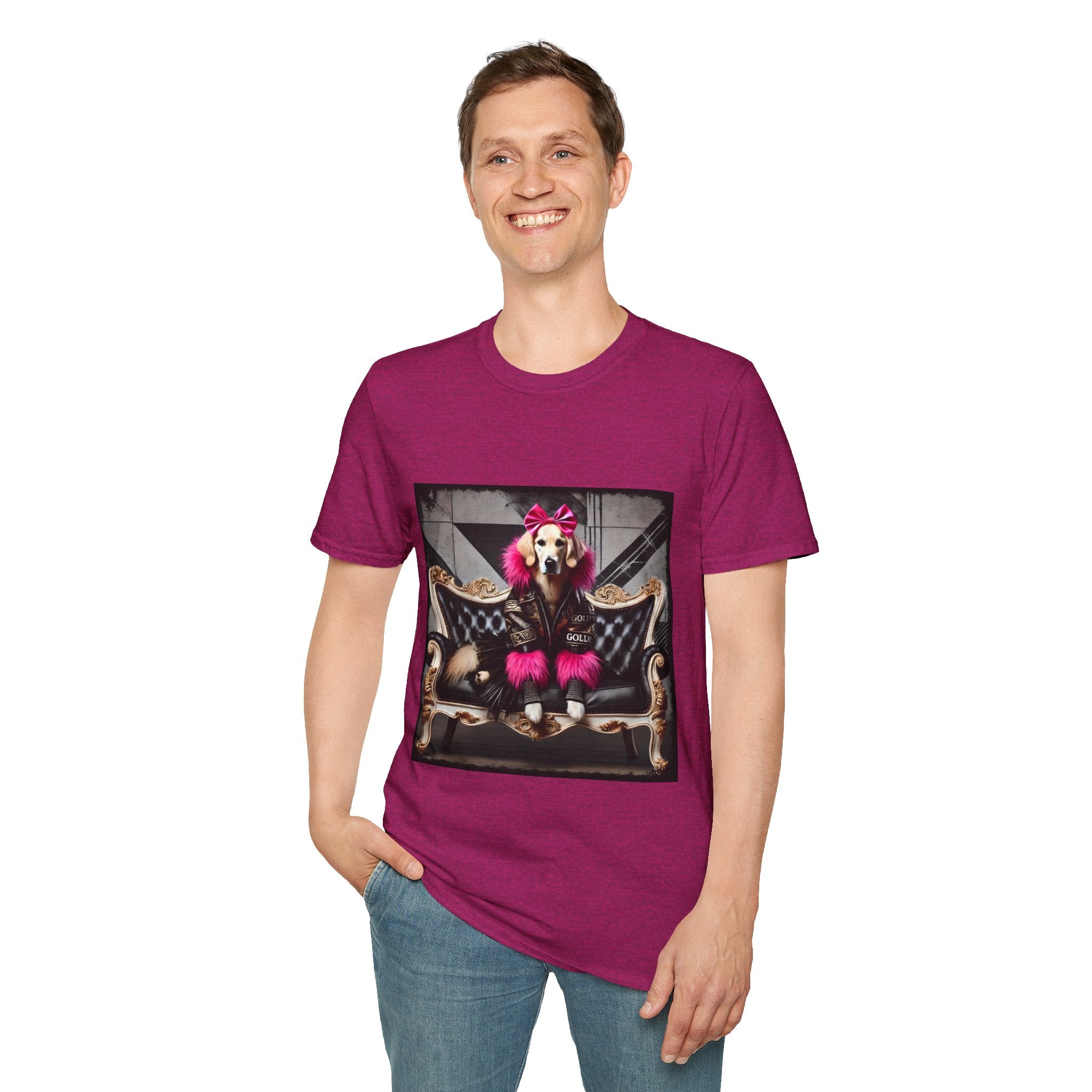 Male model in heather berry dog t-shirt featuring golden retriever with pink bow and fur outfit on black settee in edgy backdrop.