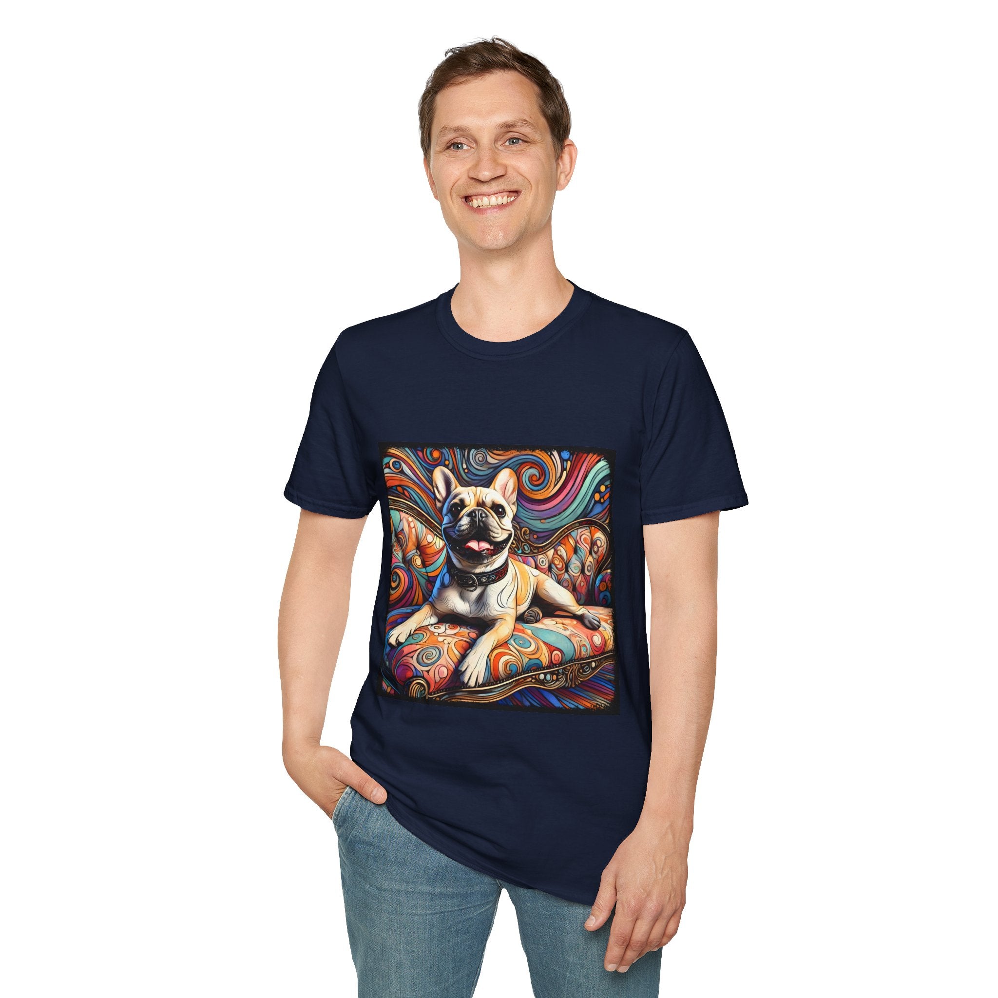 Man smiling in navy blue dog t-shirt featuring fawn French Bulldog with collar on swirl settee and vivid background.