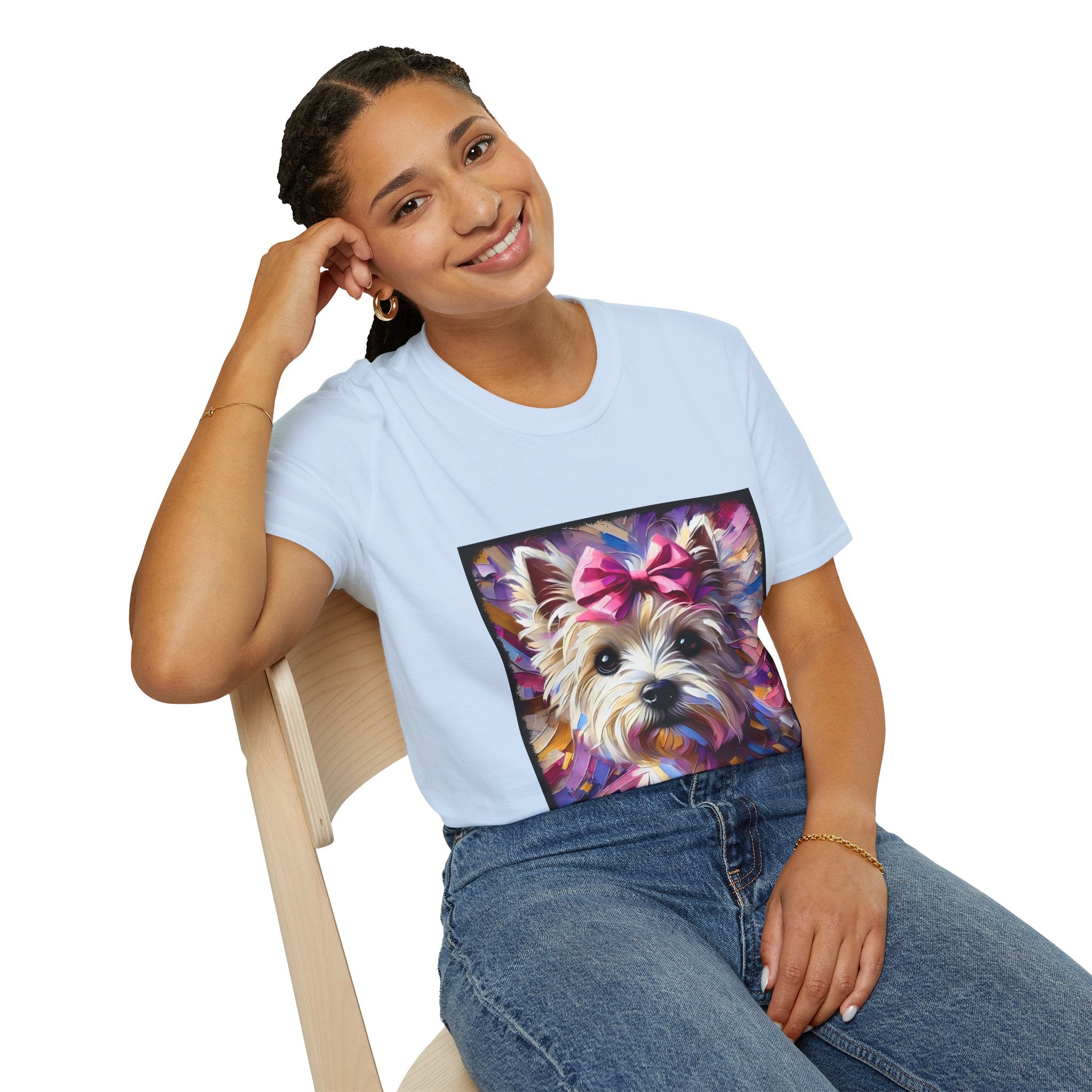 Female model in light pink dog t-shirt with Westie face, pink bow, and bold brushstroke colors in purple, pink, and gold.