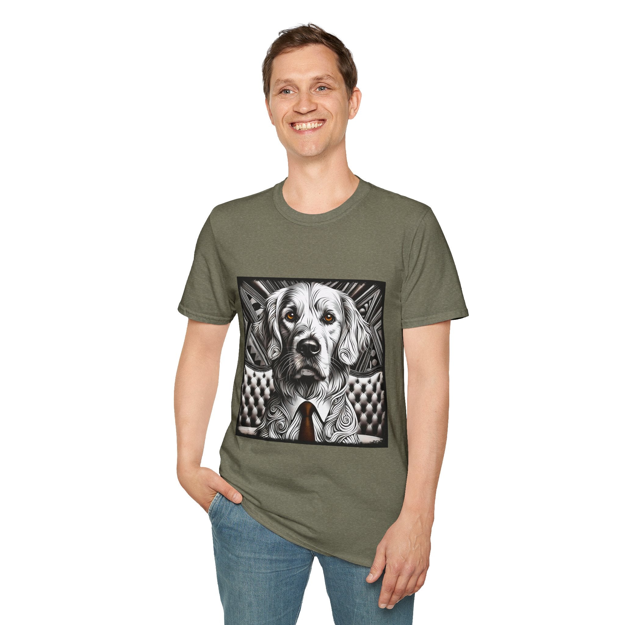 Male model in heather military green dog t-shirt featuring monochrome golden retriever with brown eyes and tie in front of settee.